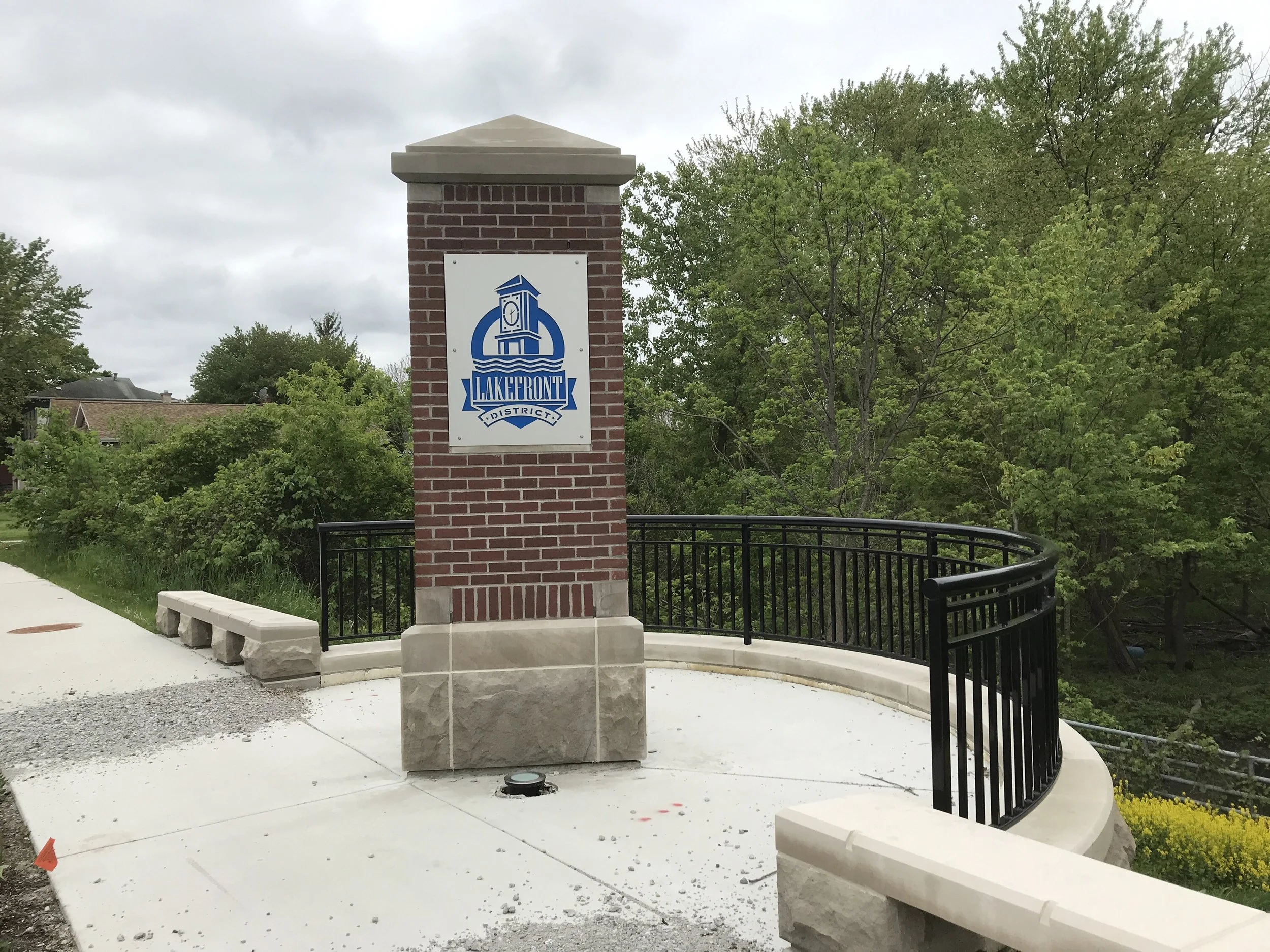 Custom Steel Railings Integrated with Stone Overlook Features Along the Waterfront.