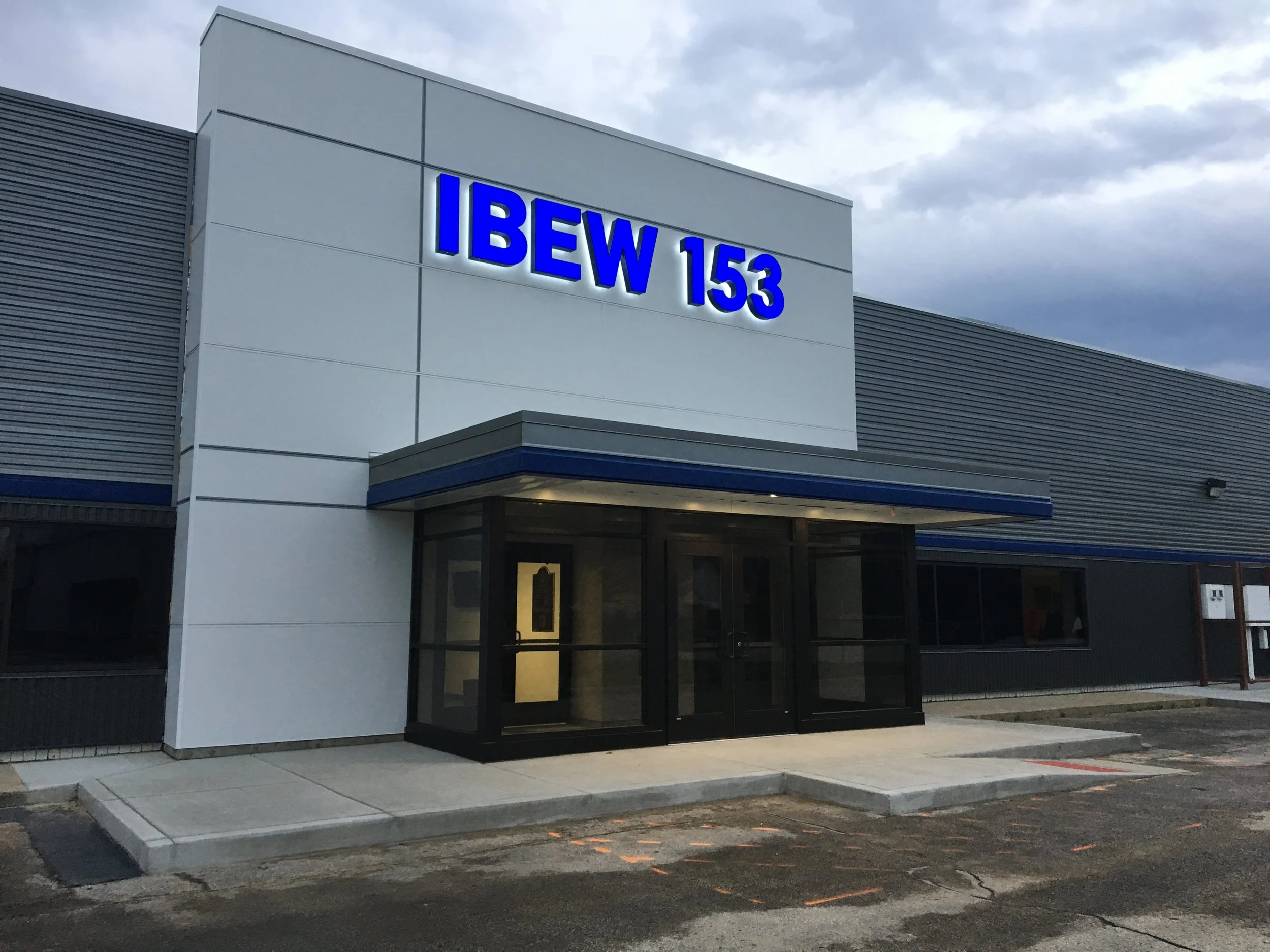 Renovated Main Entrance Featuring Modern Architectural Elements and Updated Building Façade.