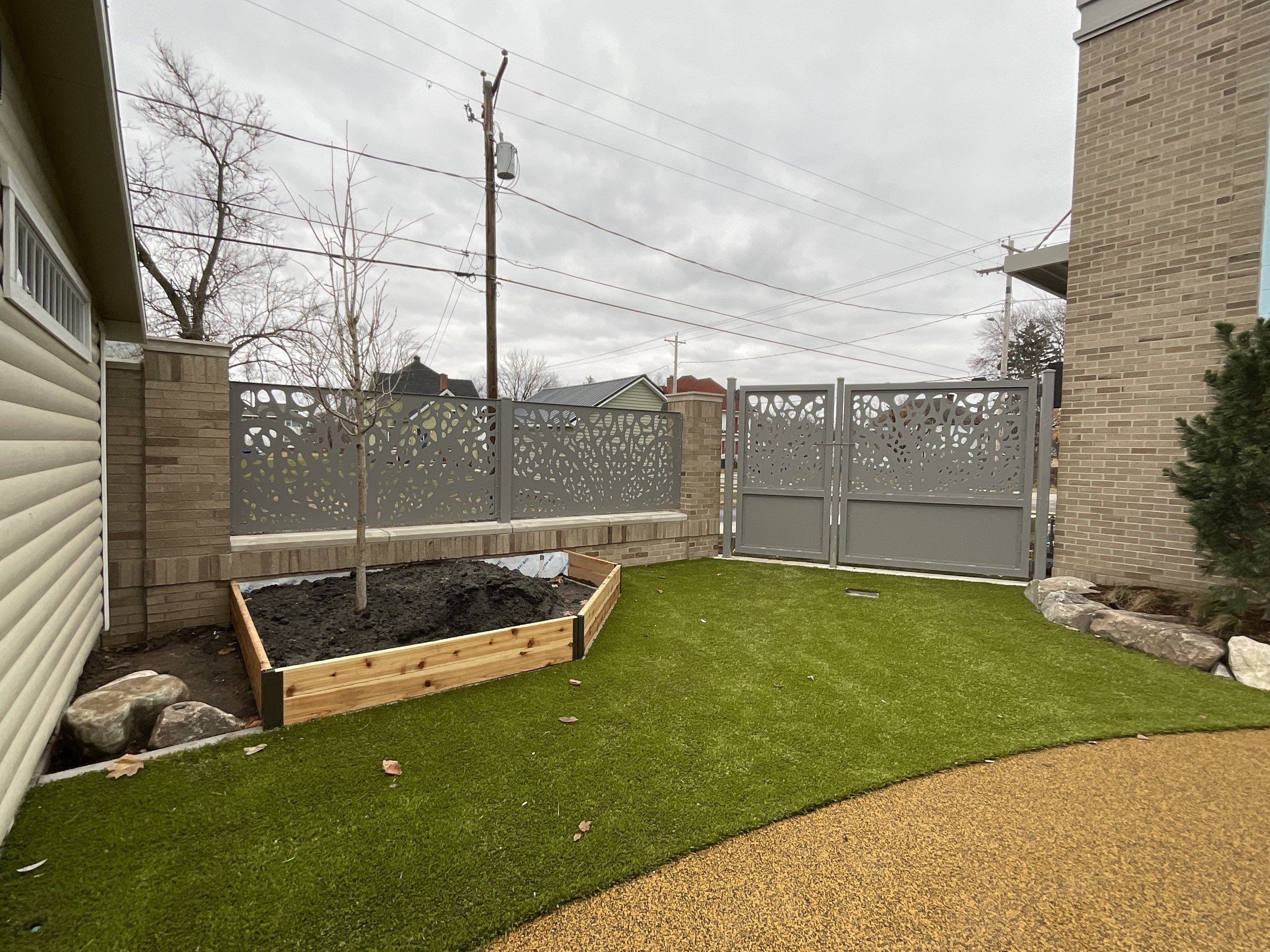 Custom Metal Gate Integrated into the Laser-Cut Playground Fencing System.