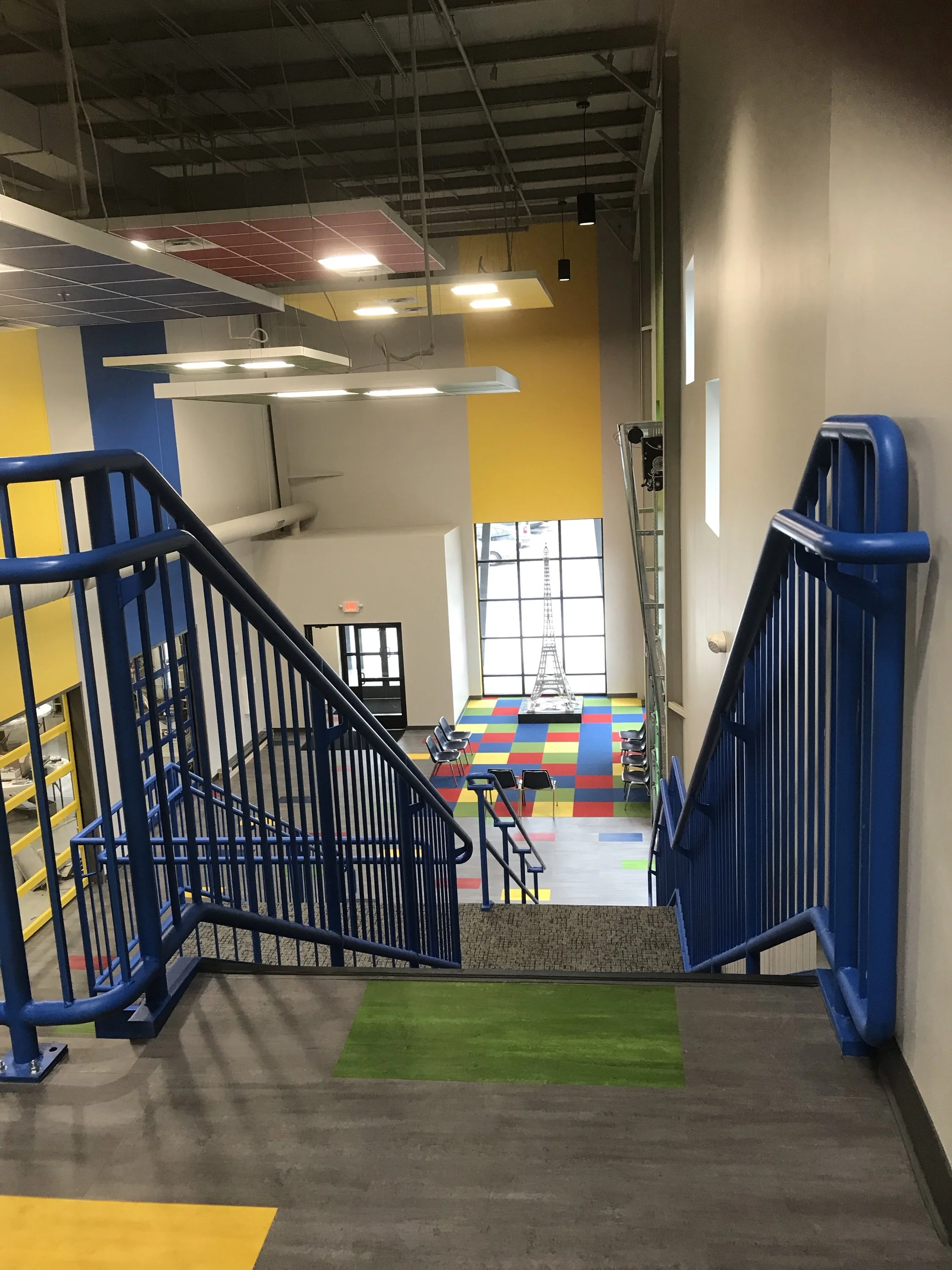 Interior Stair and Guardrail Detailing Designed for Durability, Safety, and Visibility within an Open Innovation Space.