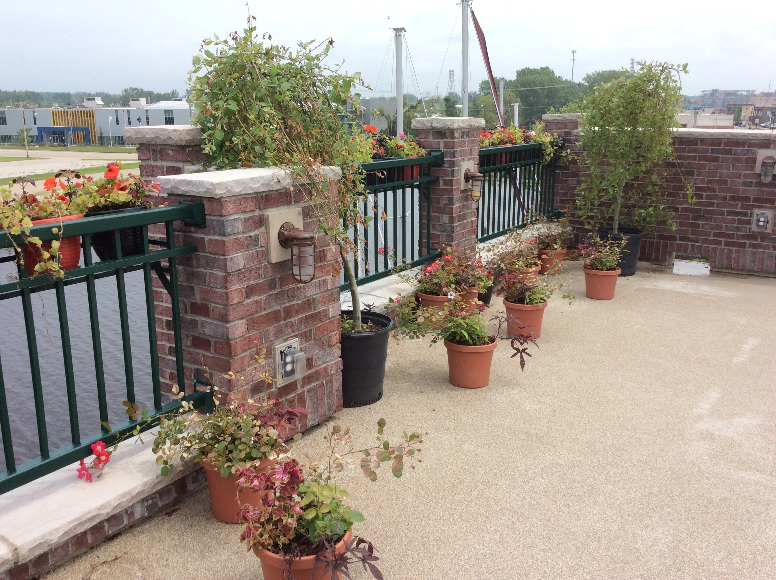 Architectural Guardrail System Integrated with Masonry Columns and Outdoor Gathering Areas.