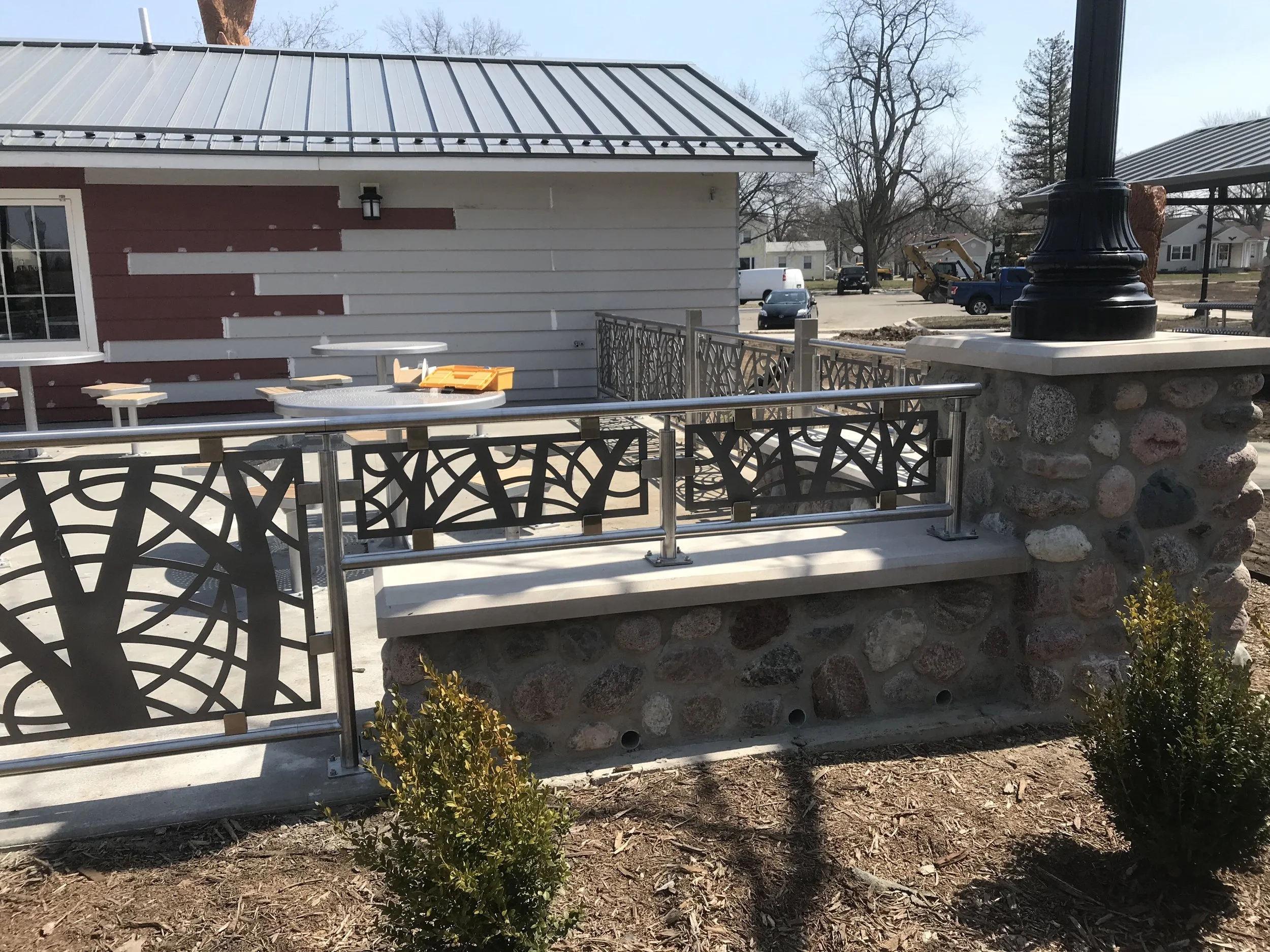 Custom Decorative Steel Railings Integrated with Stone Landscape Walls.