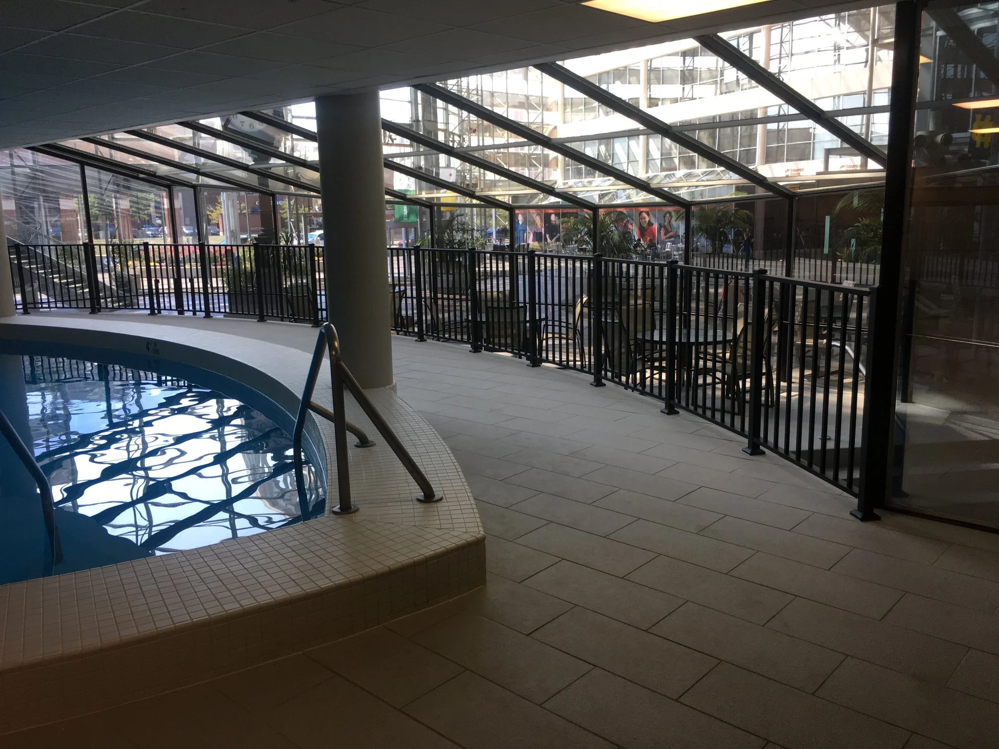 Custom Steel Guardrails Following the Curved Pool Perimeter within the Hotel Interior.