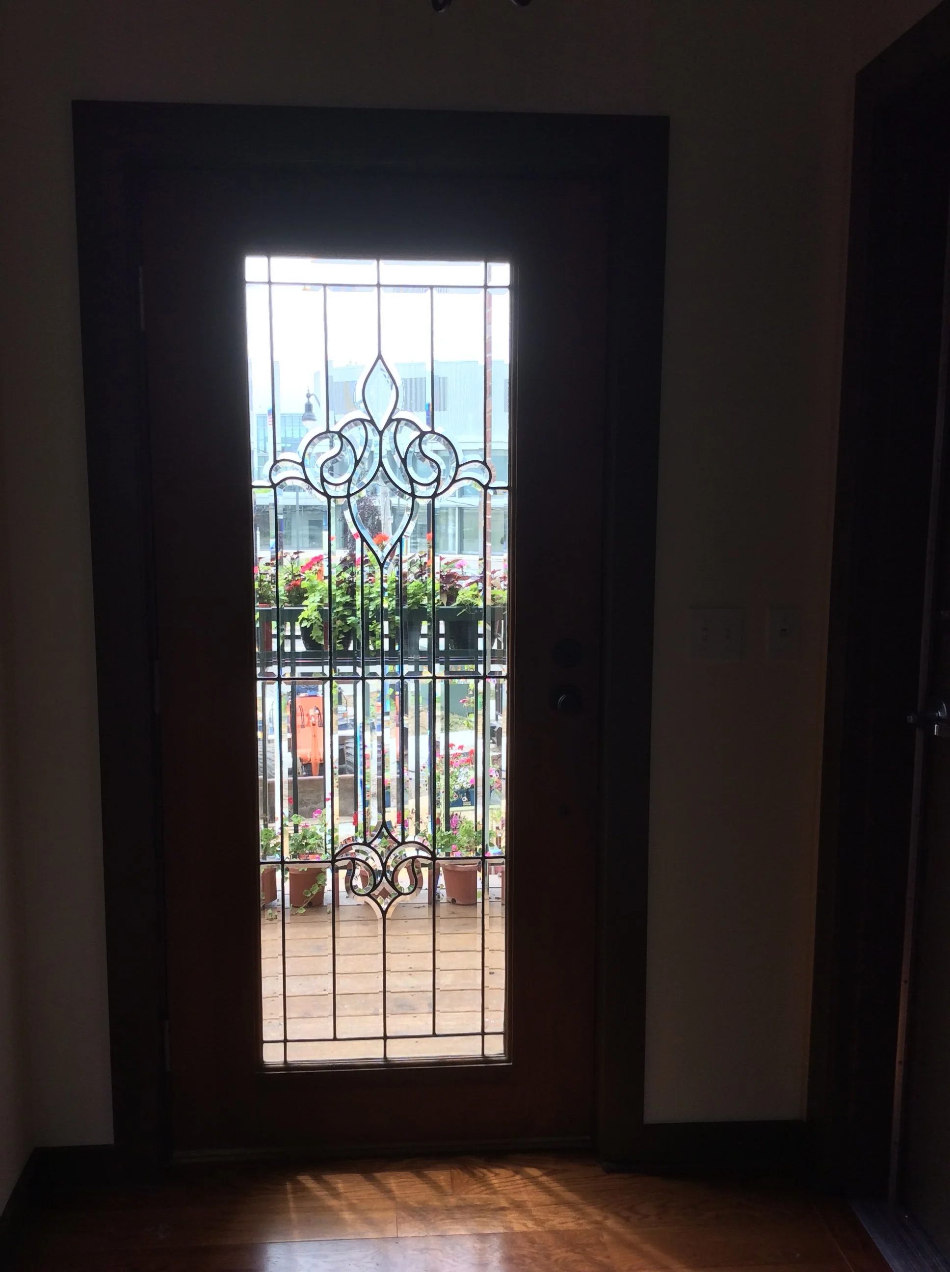 Custom Ornamental Door Insert Featuring Decorative Scrollwork Detailing.