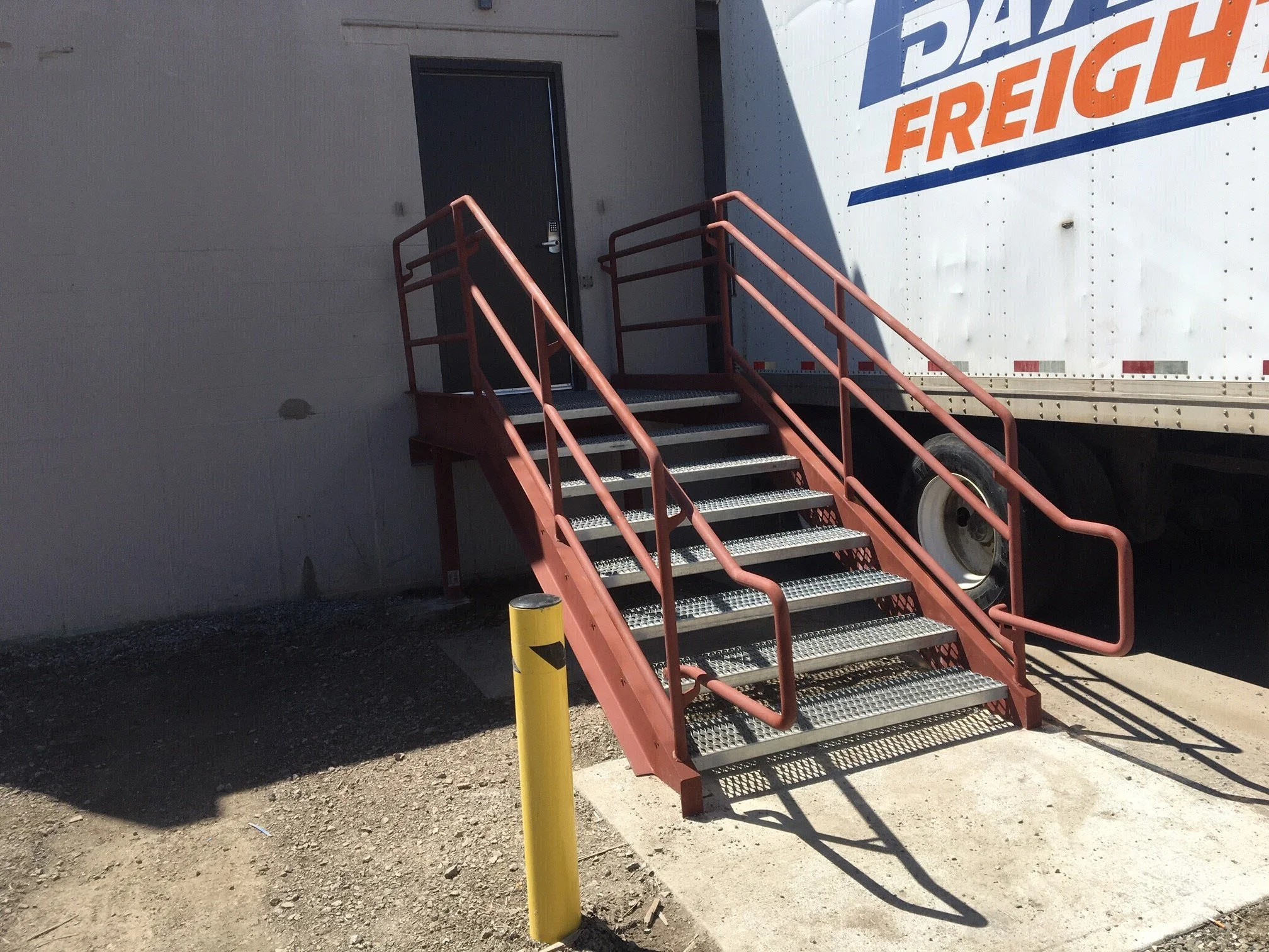 Custom Steel Access Stair and Platform System Fabricated for Loading Dock Operations.