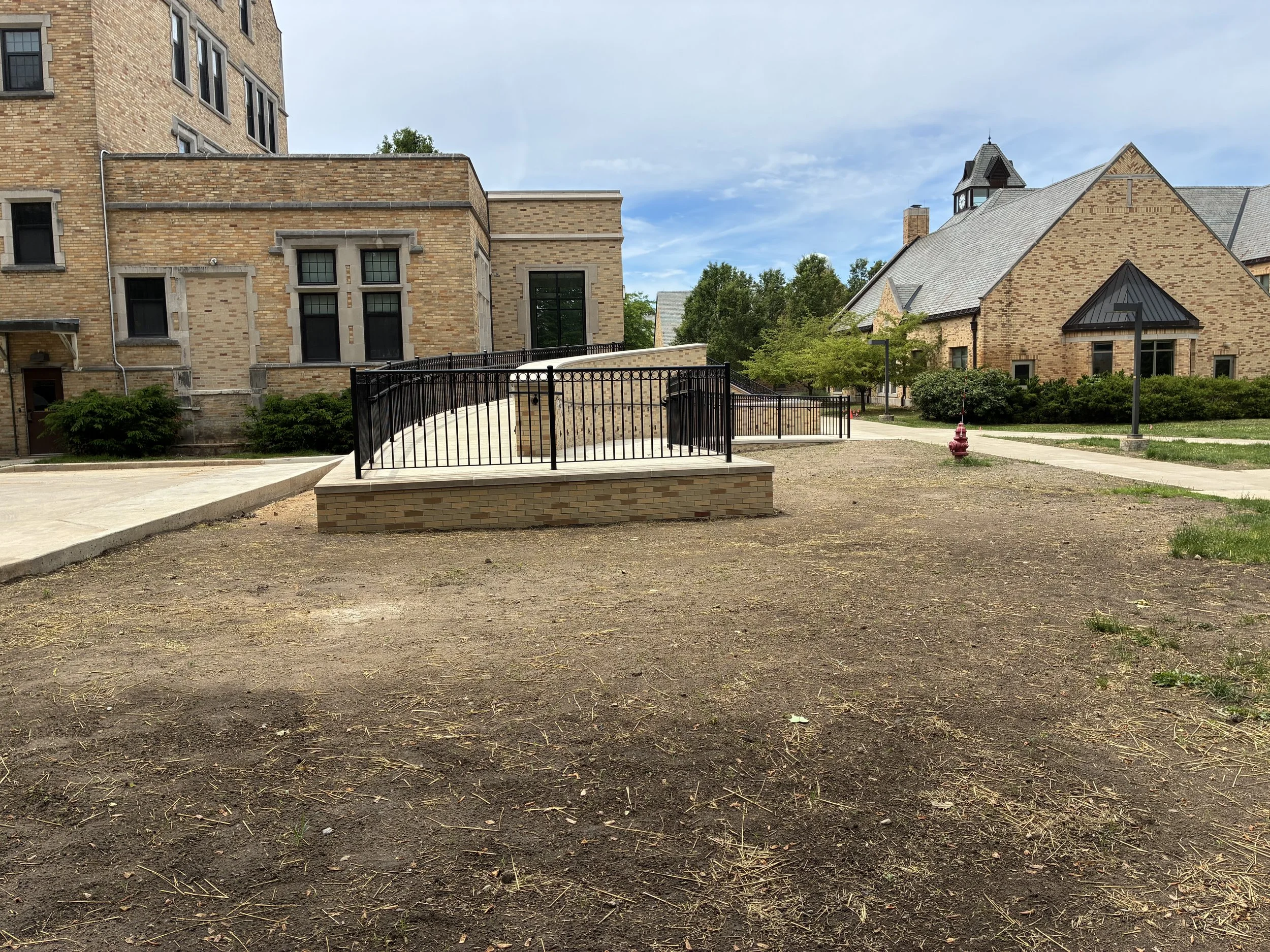 Custom Steel Railing System Integrated Along Ramped Access Paths at LeMans Hall.