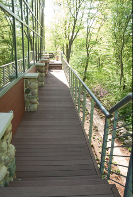 Continuous Exterior Cable Guardrails Fabricated Along Elevated Walkways Within the Wooded Campus.