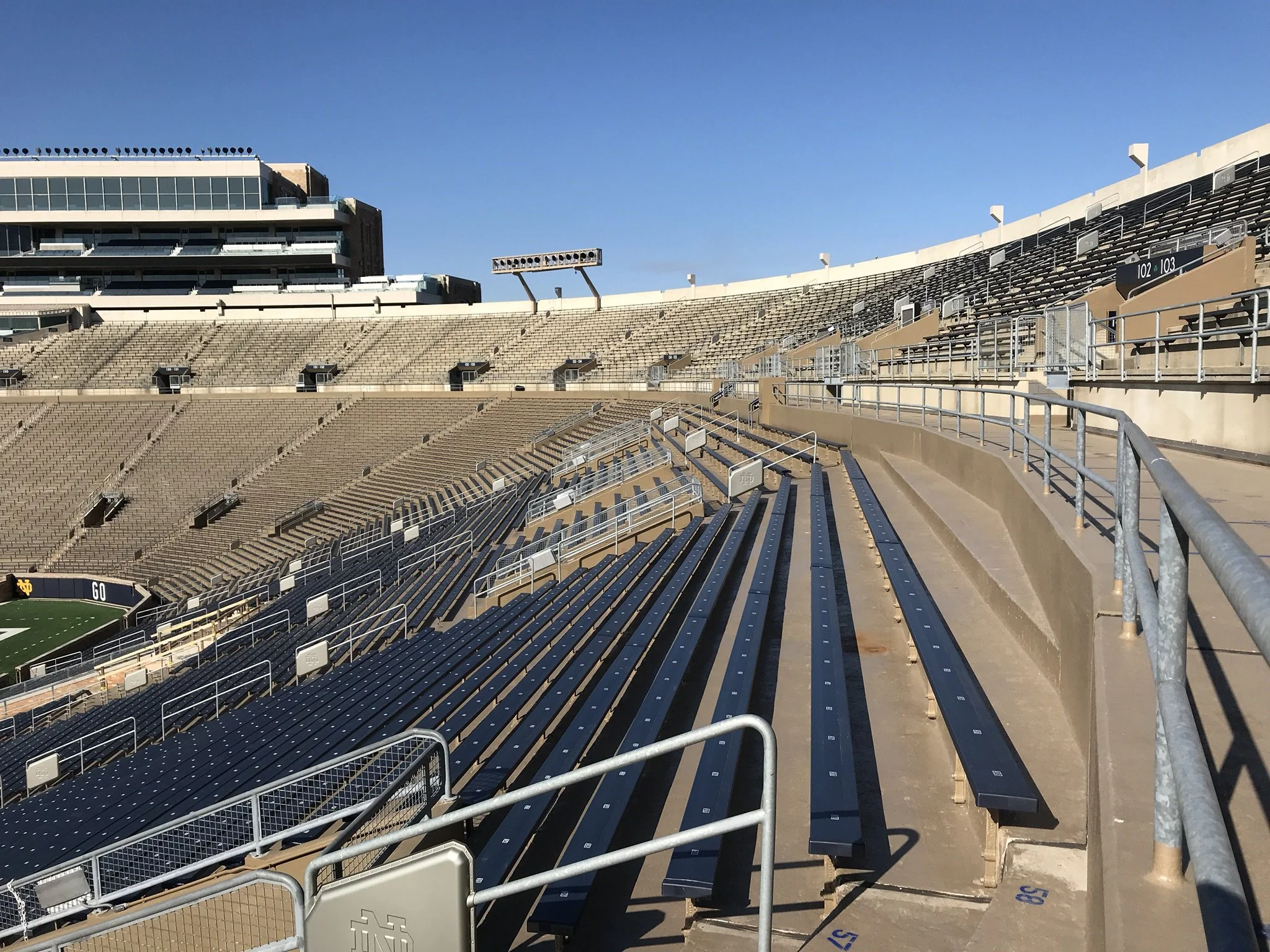 Powder-Coated Steel Aisle and Seat Railings Fabricated for Notre Dame Stadium Seating Areas.