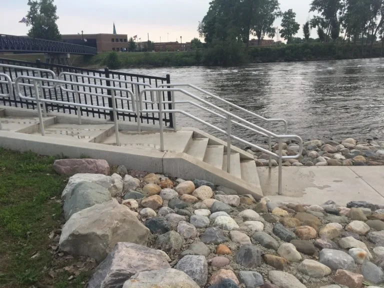 Public Riverfront Stair and Guardrail System Integrated into Landscaped Riverbank Conditions.