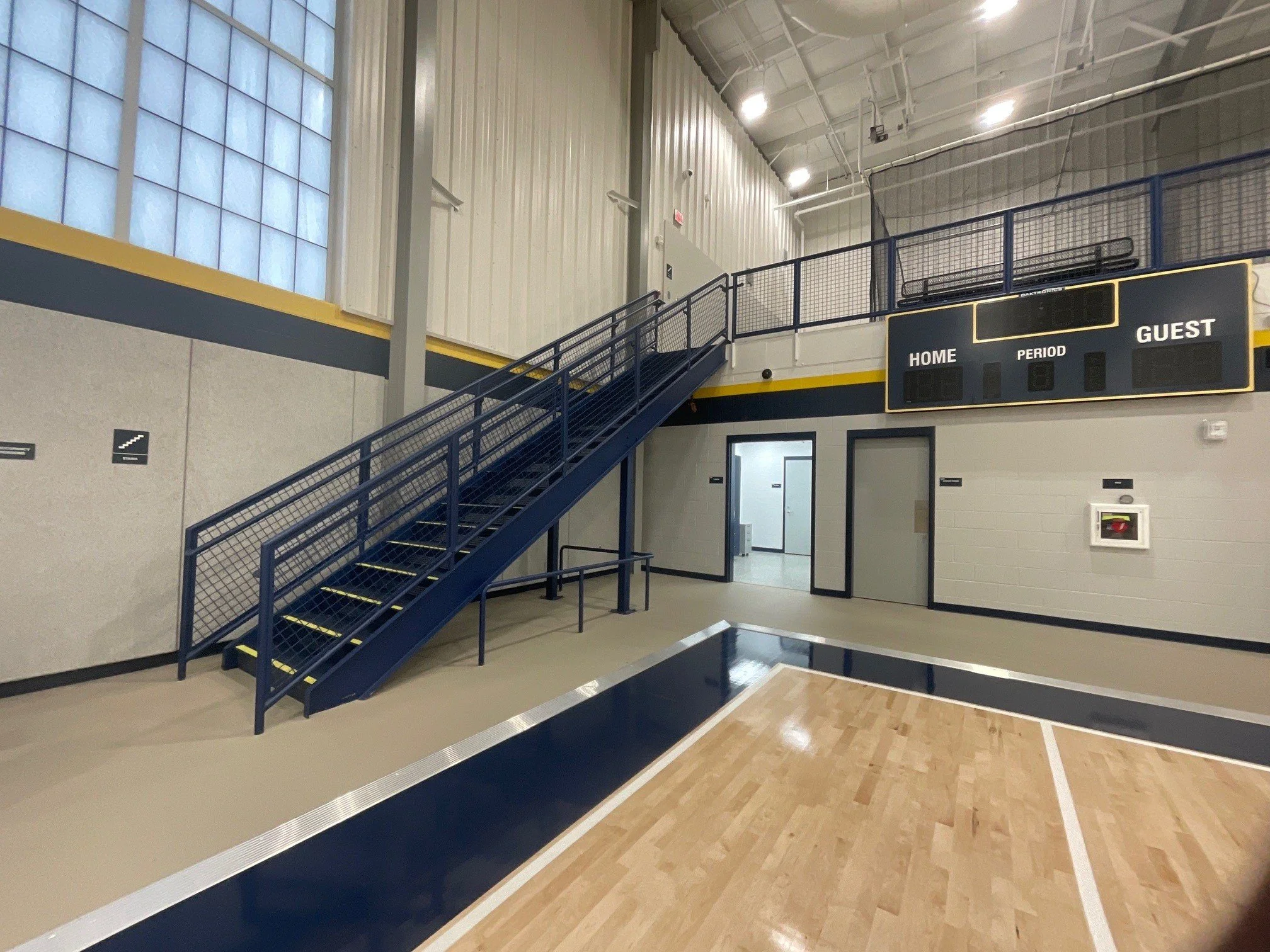 Custom Steel Stair and Mezzanine Access System Installed Within Fairfield Schools Athletic Facilities in Goshen, Indiana.