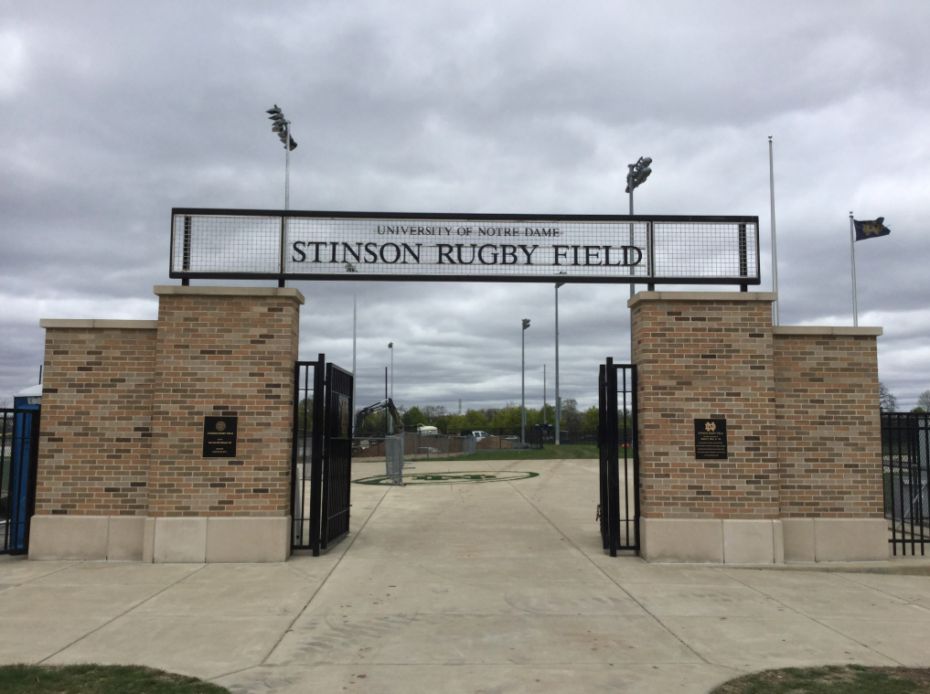 University of Notre Dame Stinson Rugby Field metal gateway sign between brick columns