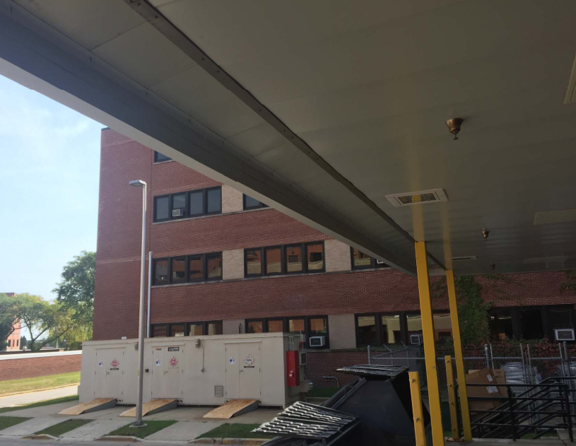 Custom Steel Support Members and Finished Soffit Detailing Beneath the Canopy Structure.