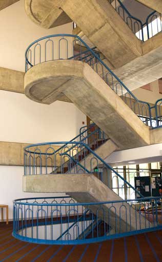 Monumental Interior Stair with Custom Steel Guardrail System Fabricated for Campus Circulation.