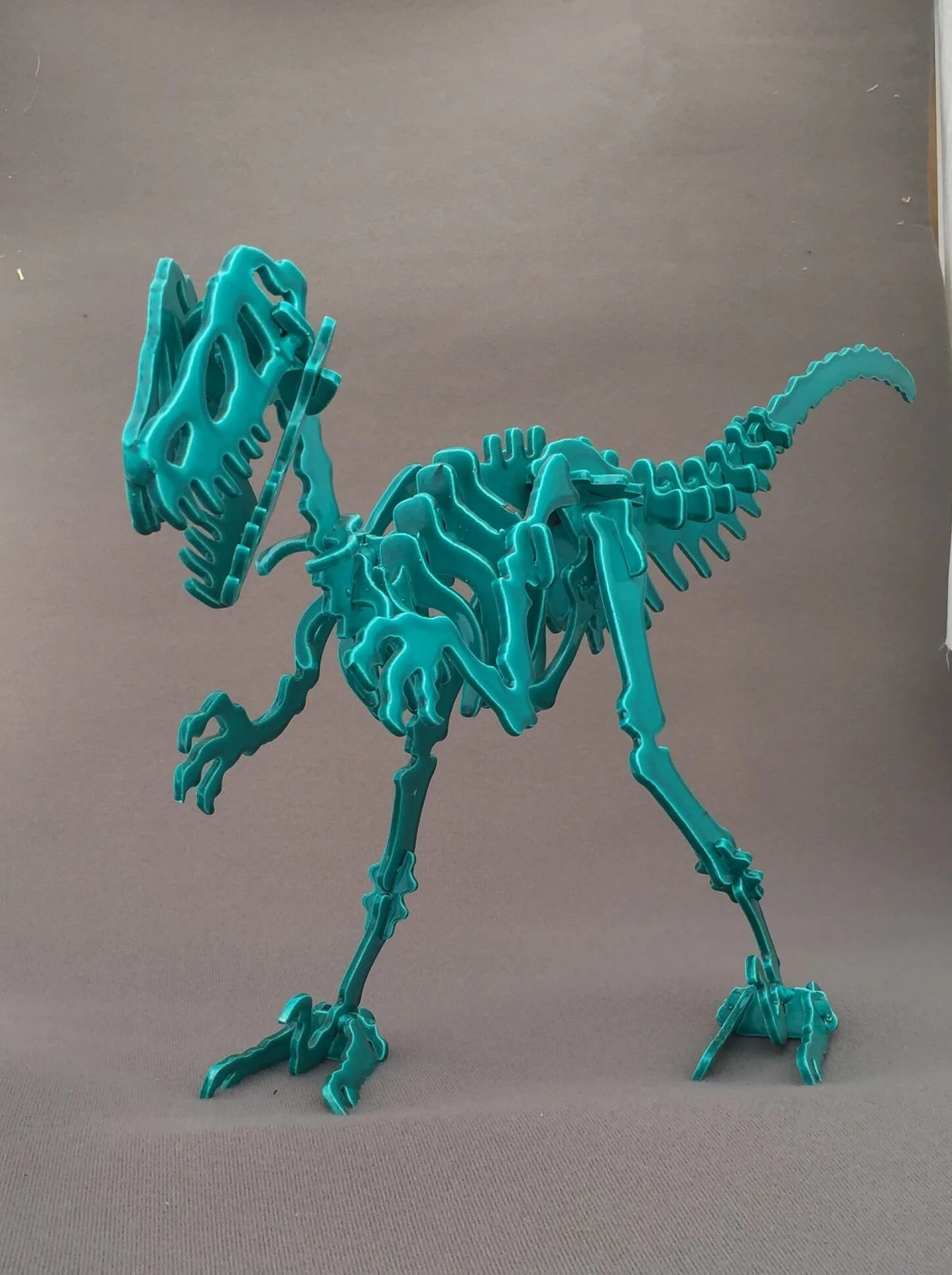 Custom fabricated metal dinosaur sculpture.