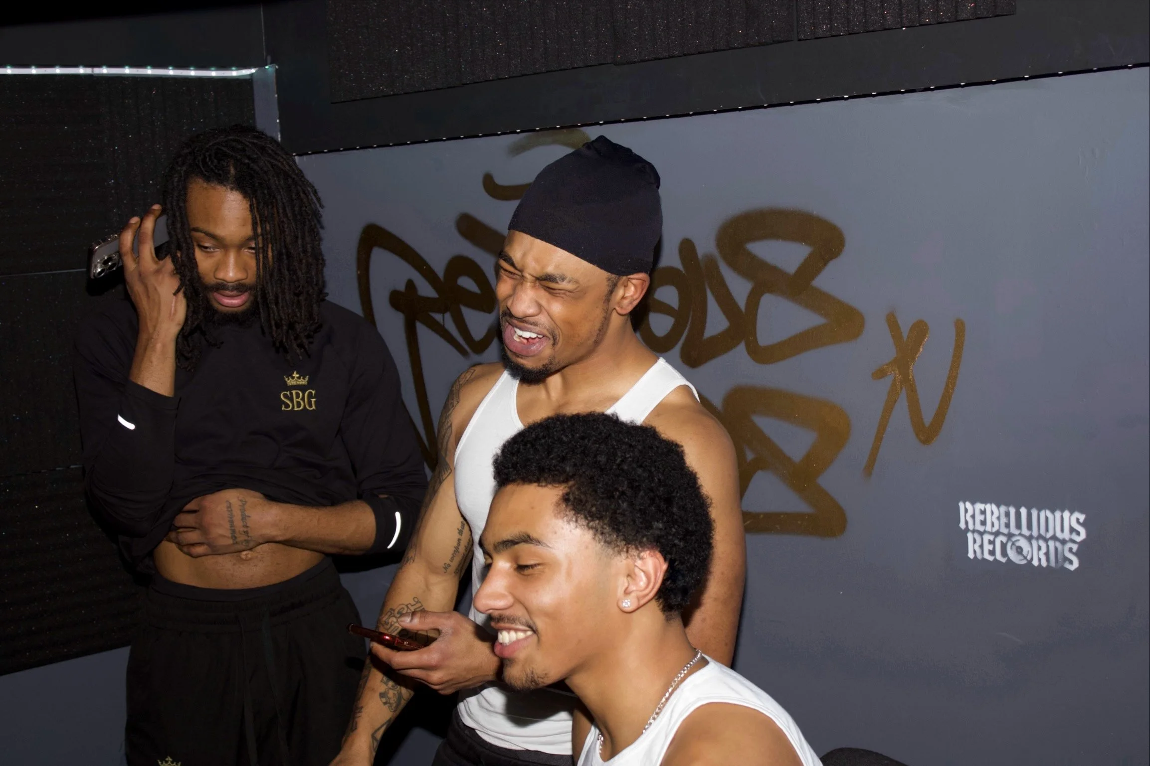 Artists in the lounge at Rebellious Records recording studio, Hackney Wick, East London