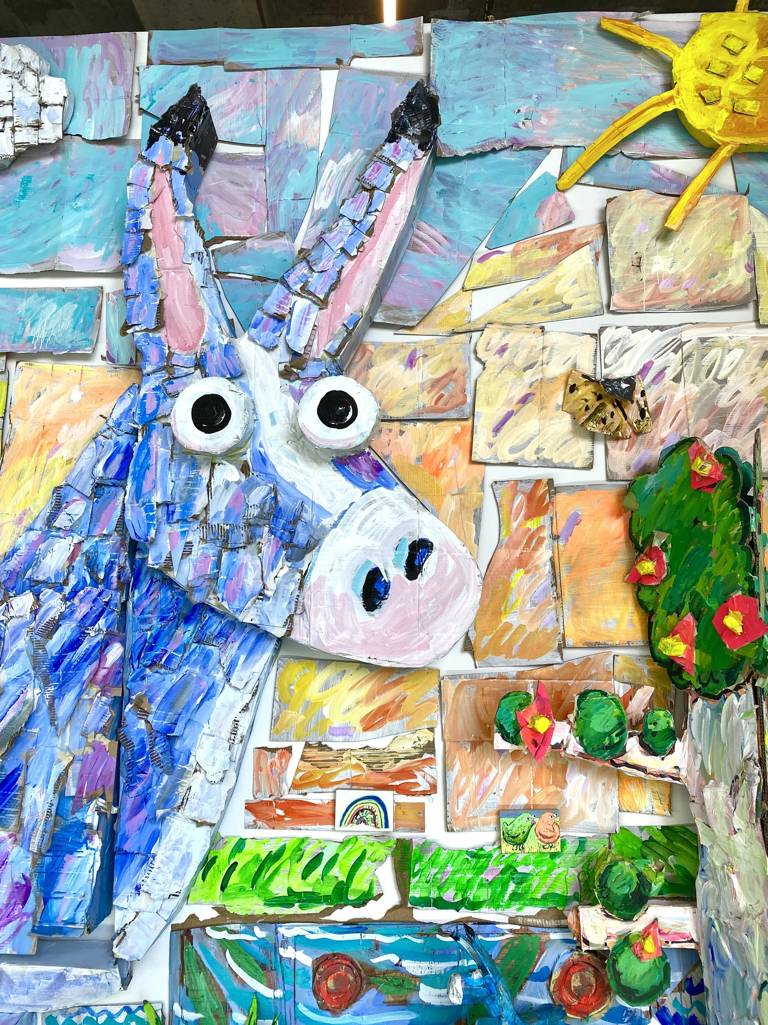 A Lifetime of Joy and Worry (detail),  Acrylic on cardboard, cellophane, wood panels, 12 x 20 x 1.5 ft, 2024