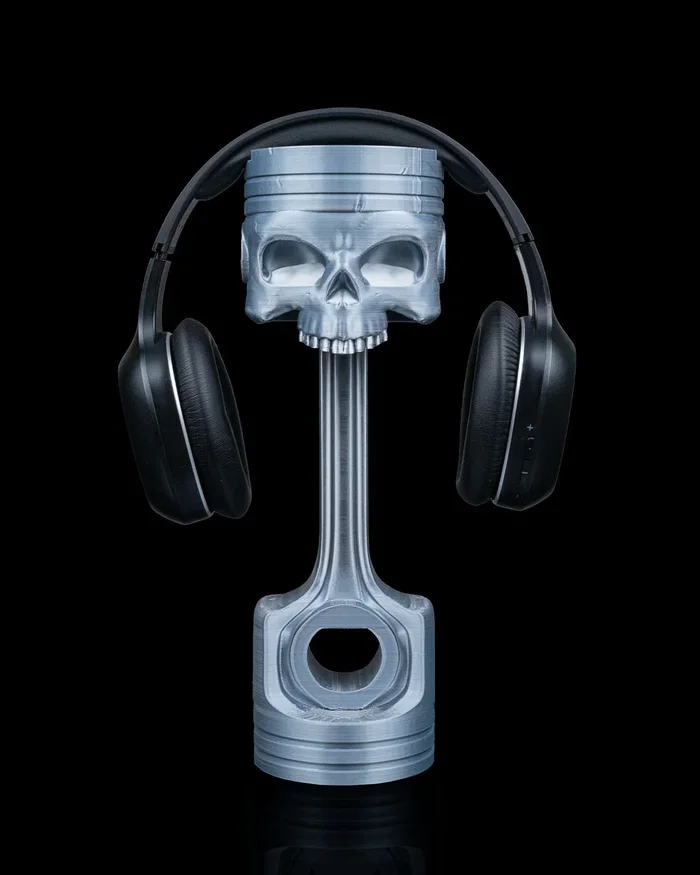 3D Printed Skull Piston Headphone Holder – Unique headphone stand featuring a detailed skull and engine piston design. Perfect for gaming headsets, desks, garages, man caves, and office setups.