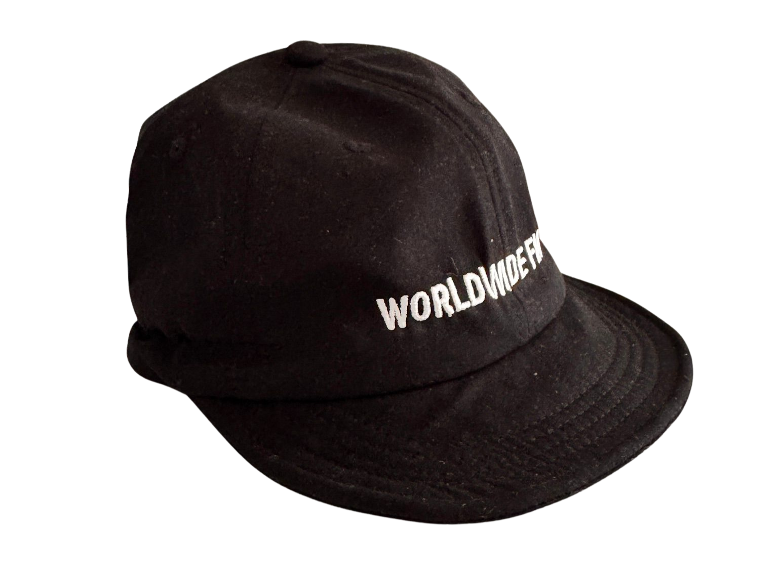 Black cap with white embroidered text that reads "WORLDWIDE FM". The cap appears to be made of a soft fabric, possibly cotton or a cotton blend.