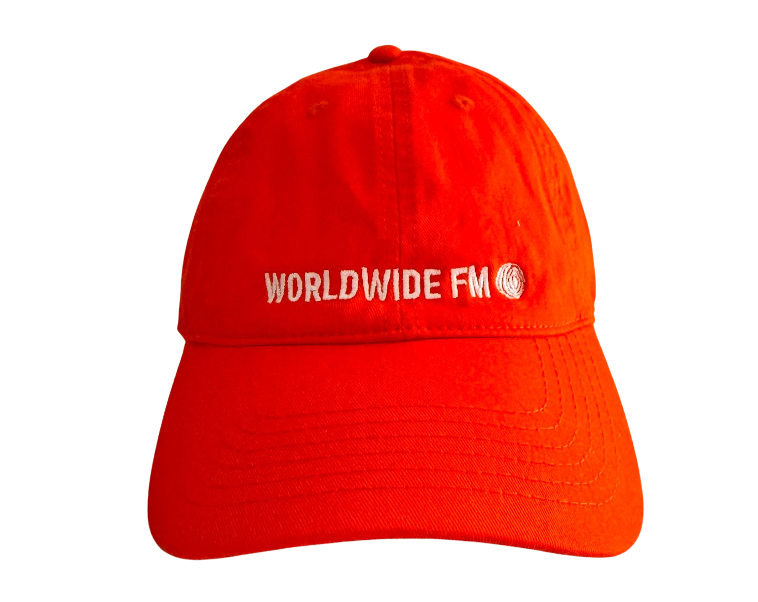 Red baseball cap with white embroidery of 'WORLDWIDE FM' and a circular logo on the front.
