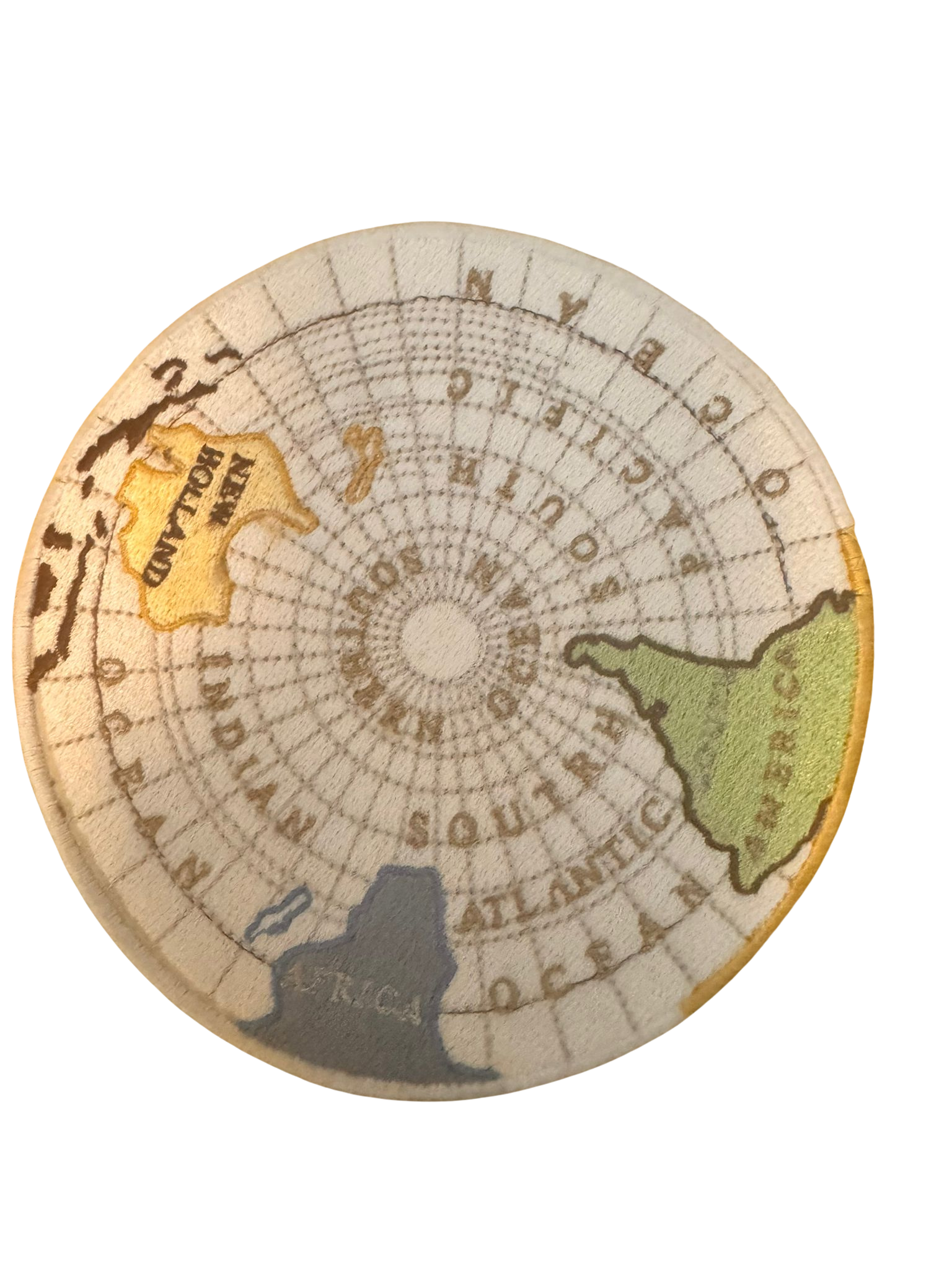 Close-up of a vintage map or globe with colorful landmasses and a decorative design.