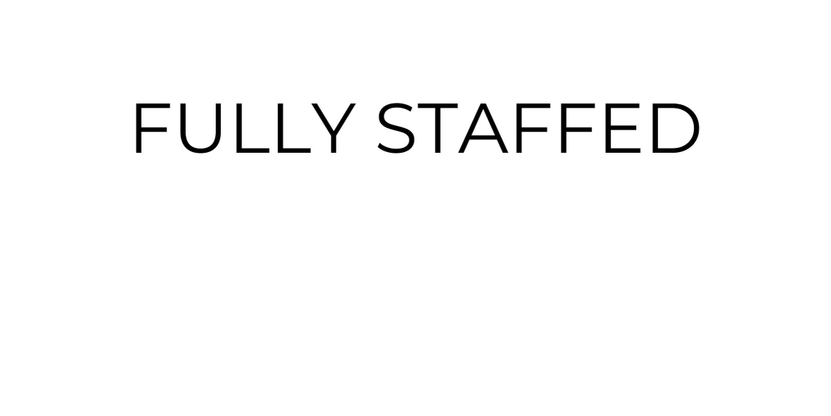 Text label reading 'FULLY STAFFED' inside a white oval background.