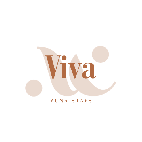 A logo with stylized brown letters spelling 'tiga' and the phrase 'ZUNA STAYS' underneath on a black background.