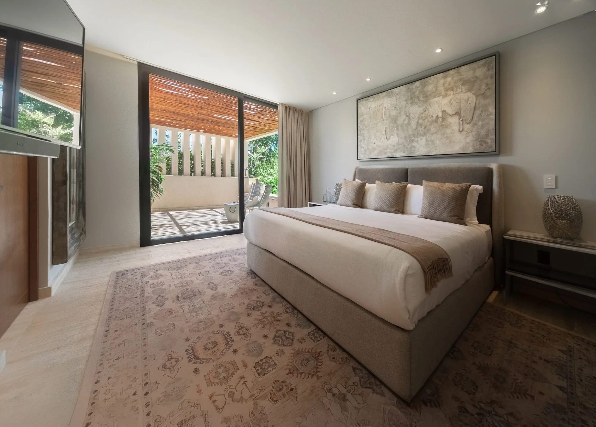 Master suite with lounge area at Villa Caimán, Tulum