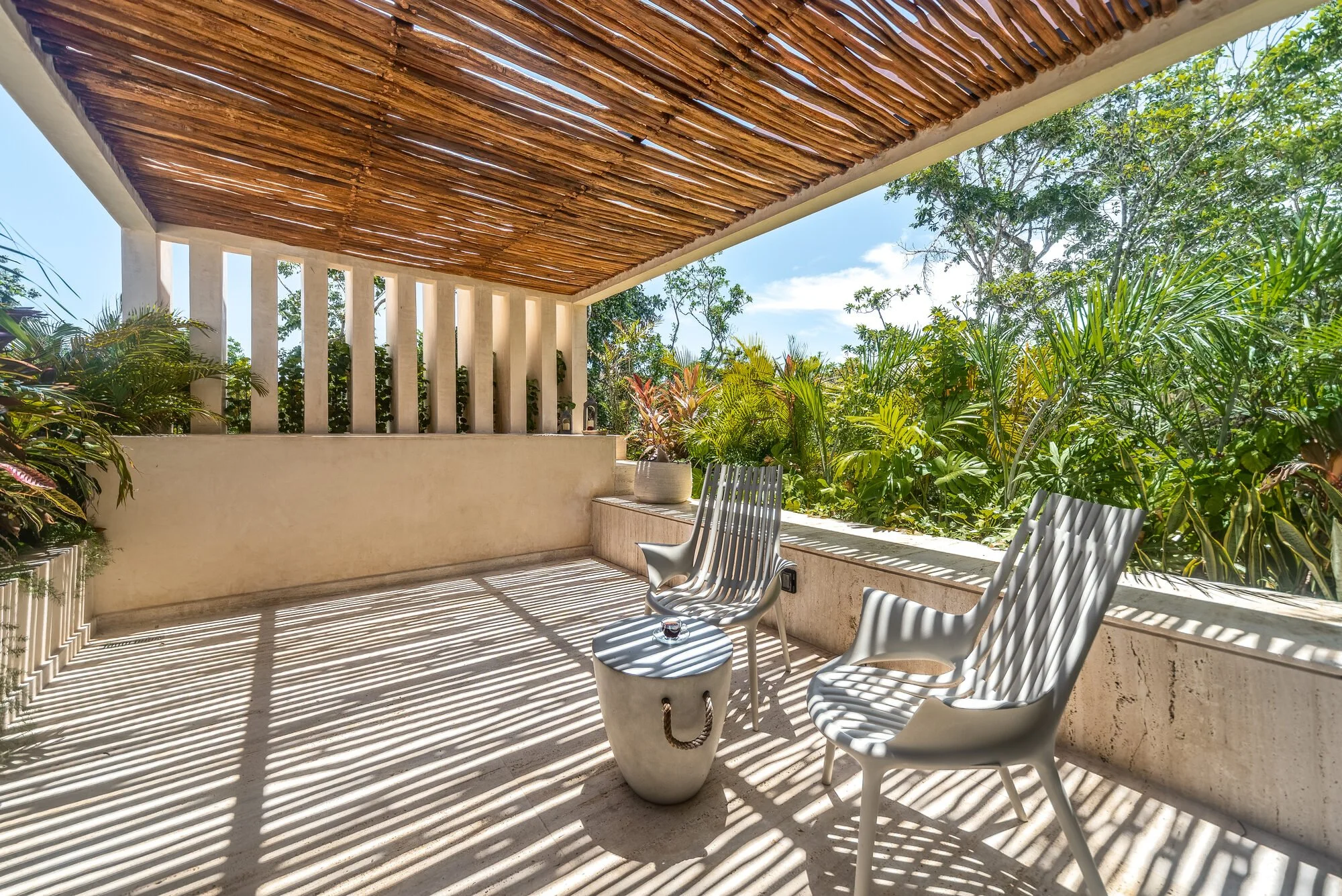 Rooftop terrace lounge with jungle views at Villa Caimán, Tulum