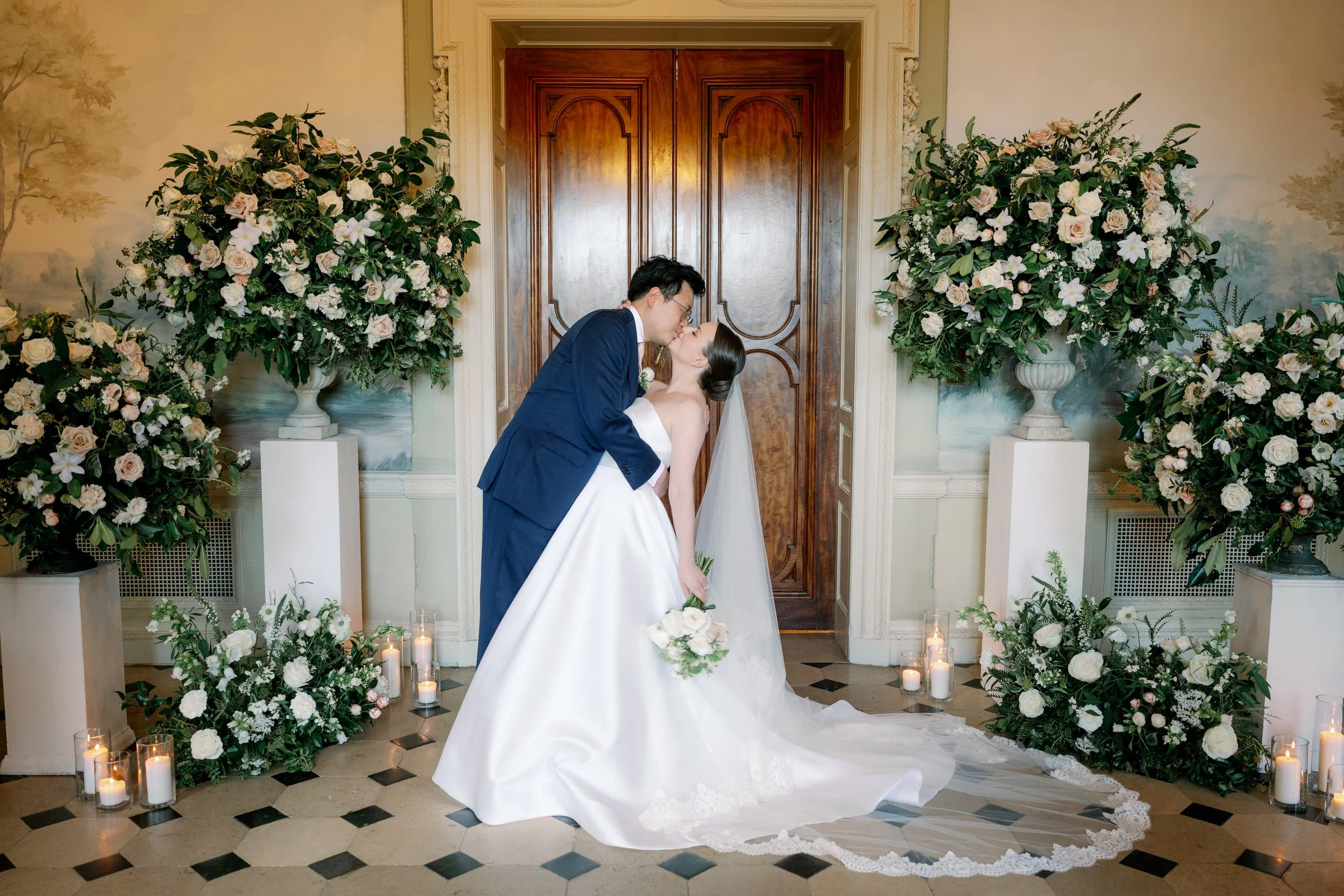 happy wedding couple with beautiful urn arrangements