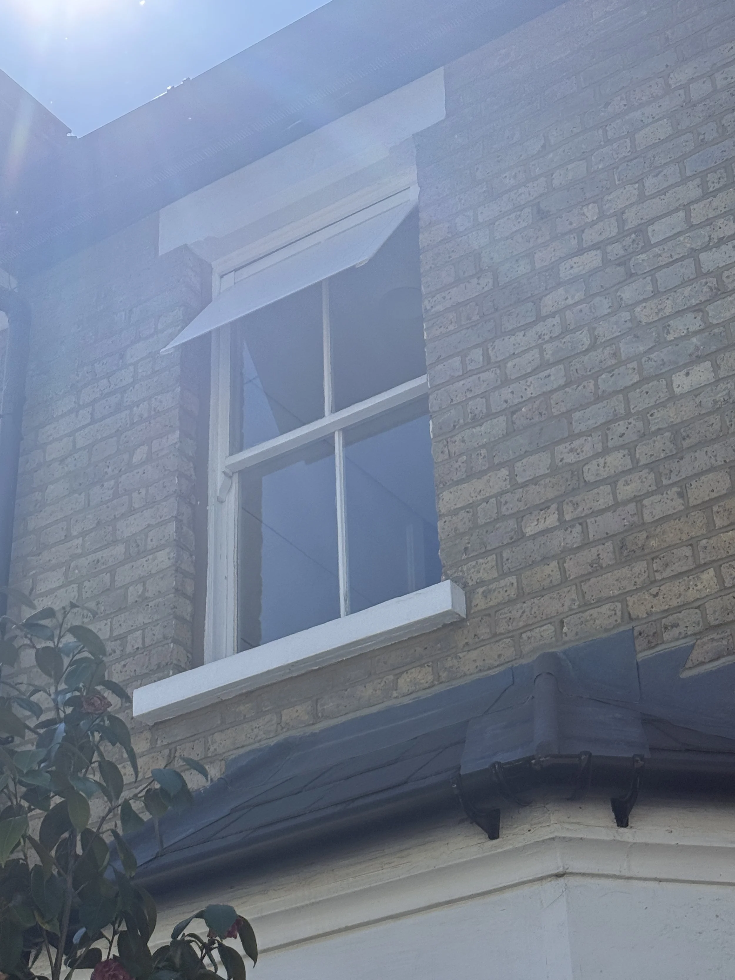 Shaded's removeable and renter-friendly awning on sash window