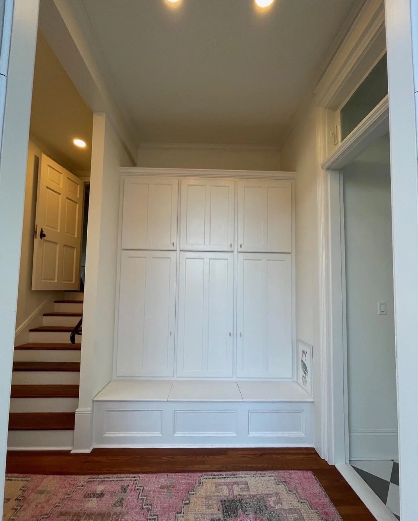Built-in mudroom cabinets and bench with storage underneath