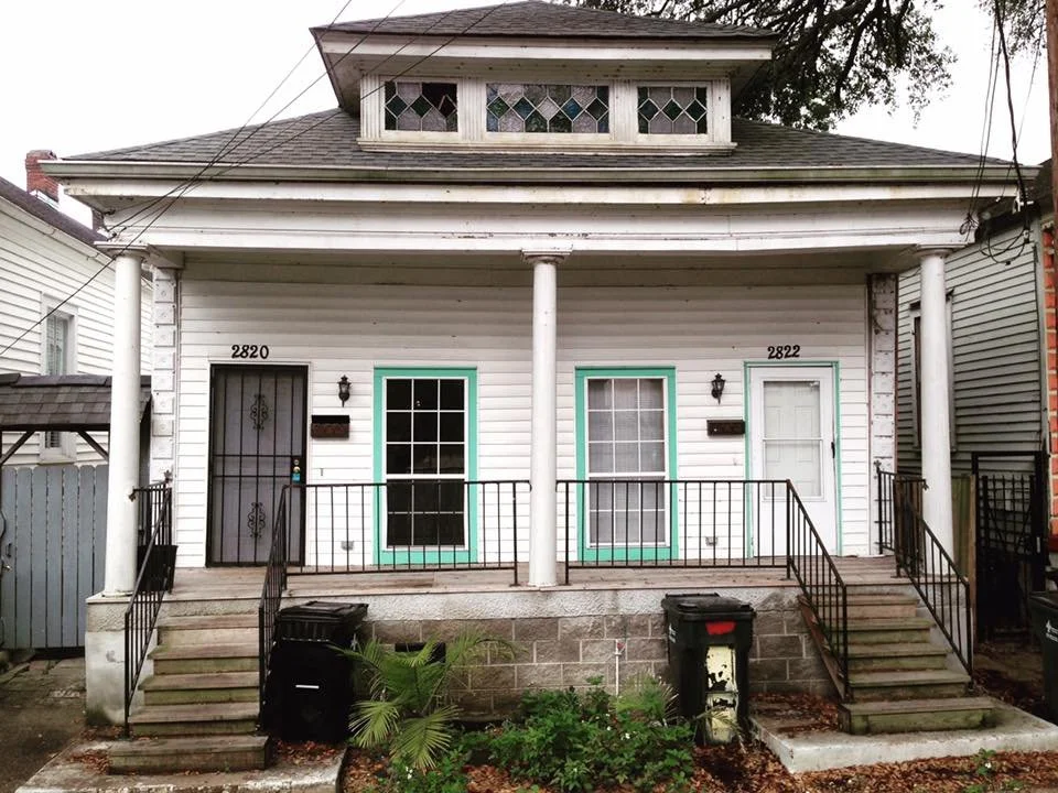 front of house before installation of new doors and windows