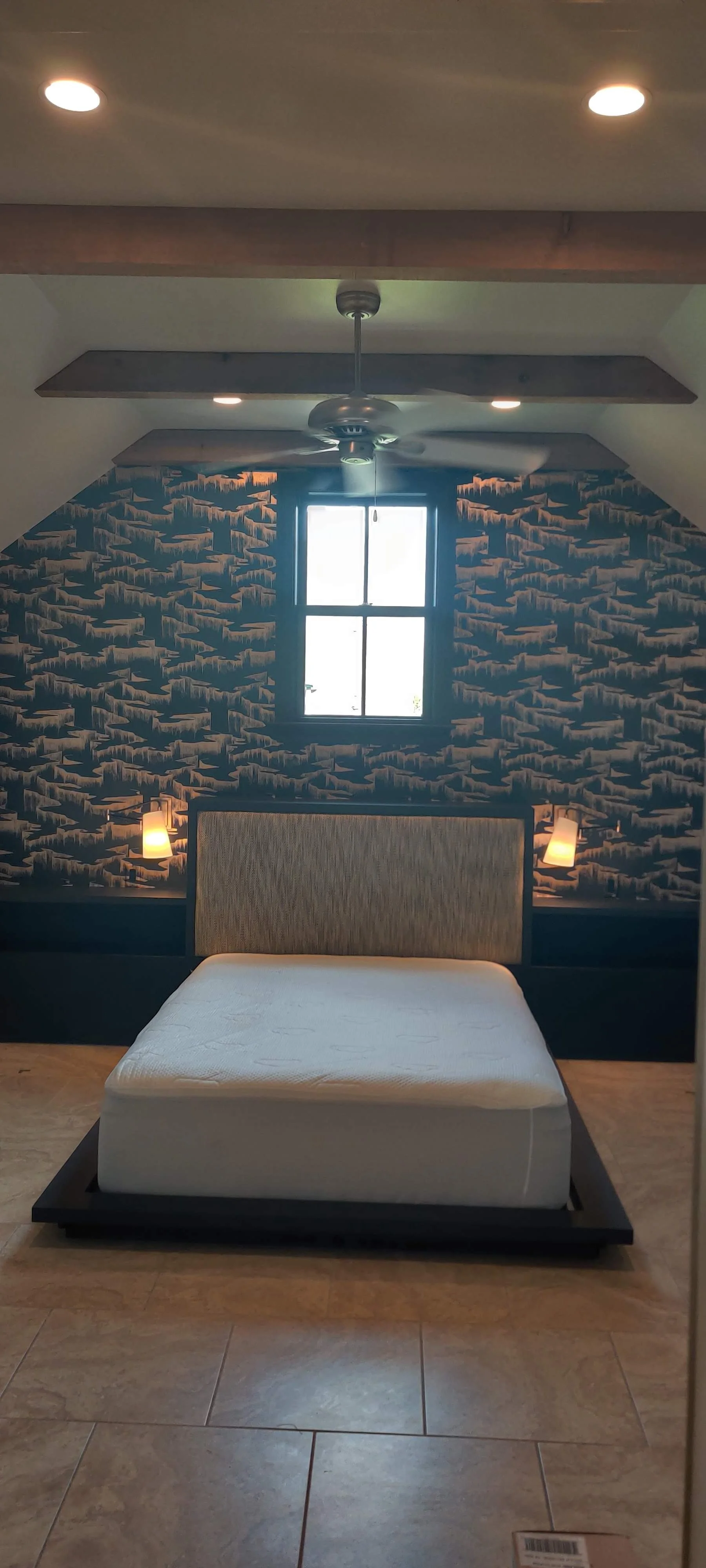 Bedroom with custom builtin in platform bed and nightstands