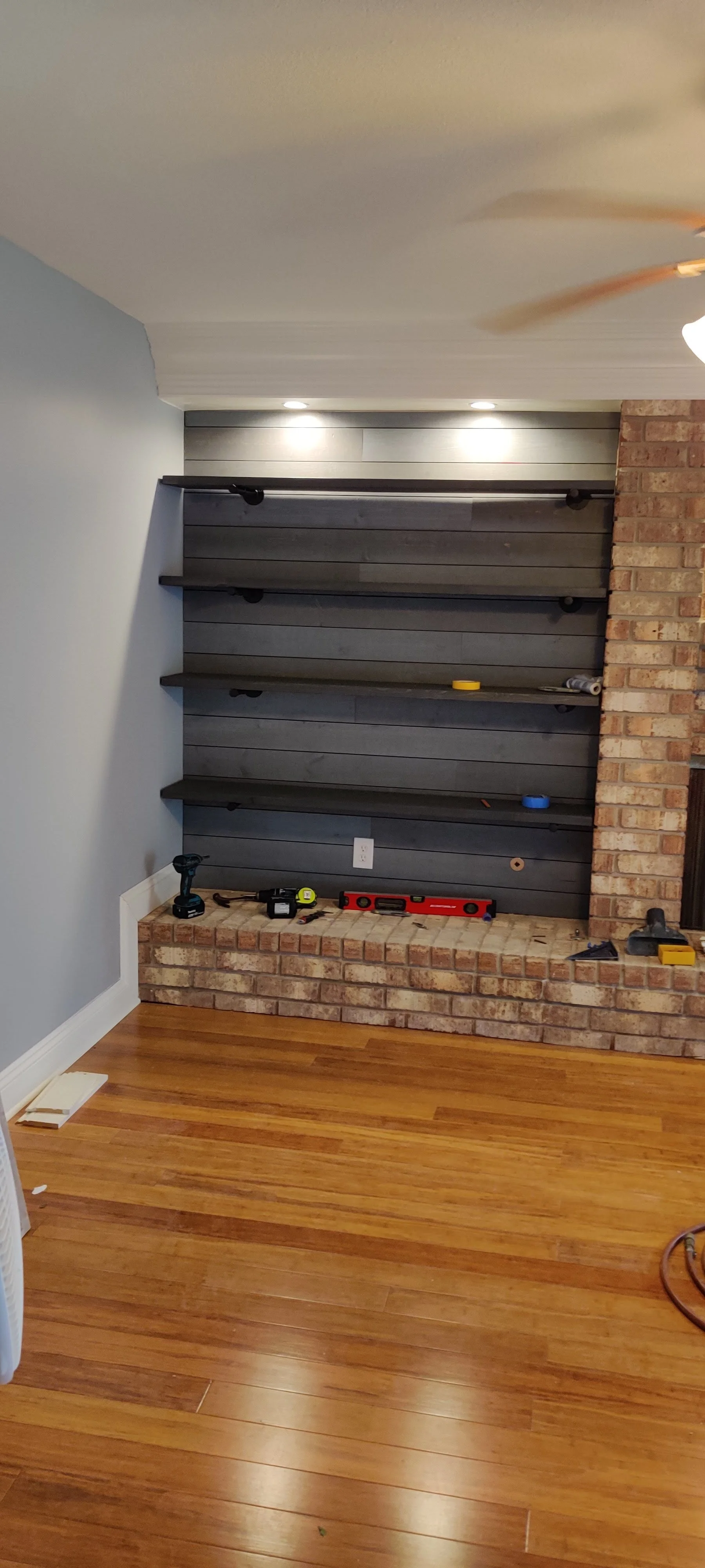 custom built-in bookshelves with shiplap accent wall