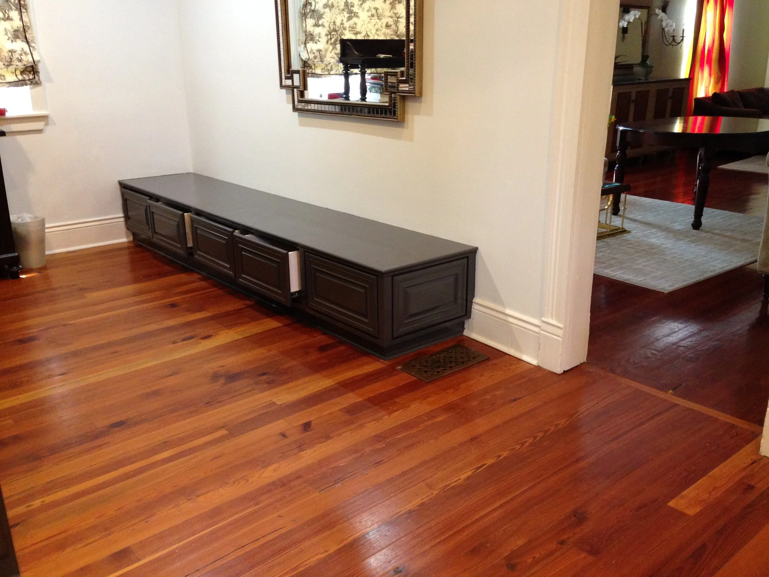 A custom built-in bench with drawers.