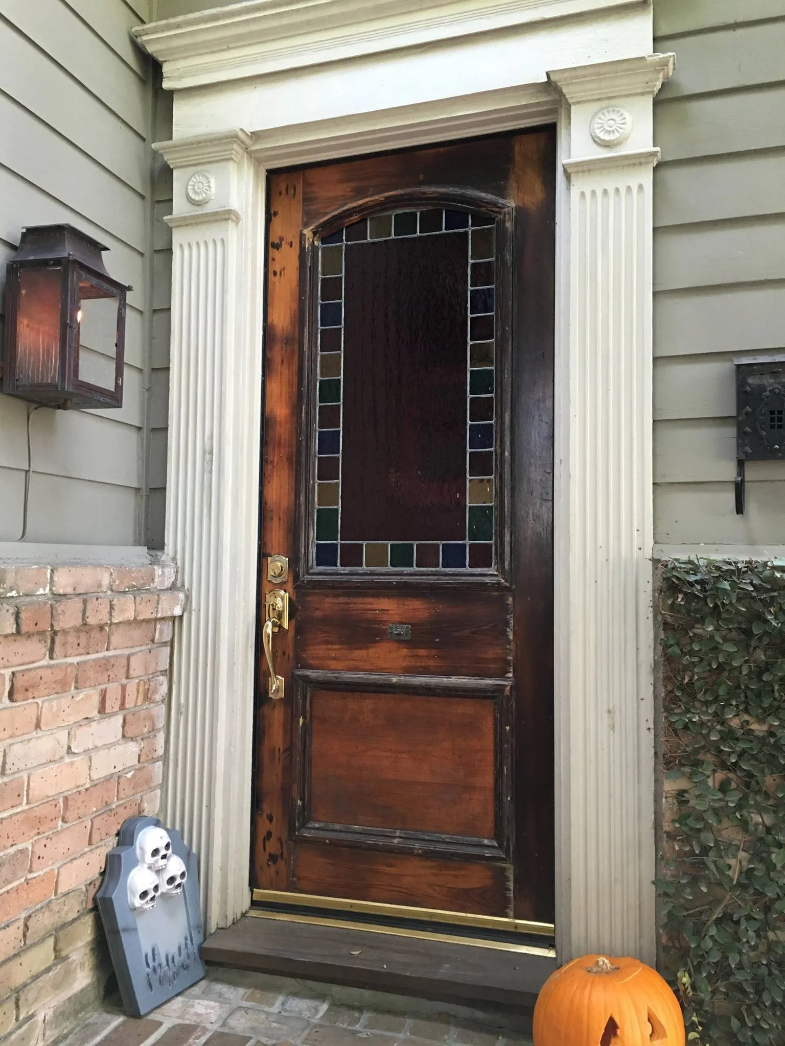 old dilapidated door before installation of new replica door