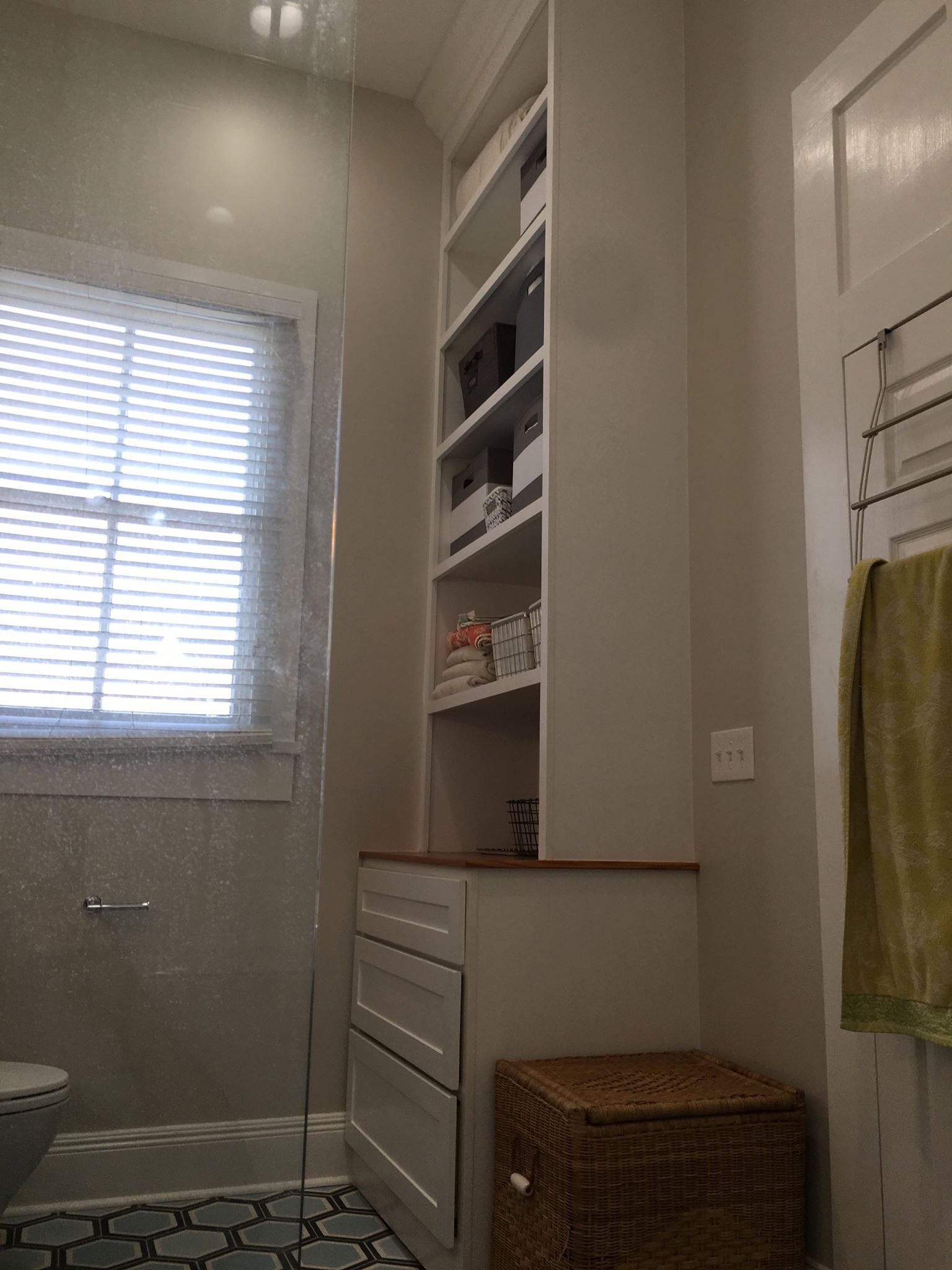Built-in bathroom storage cabinet and shelves