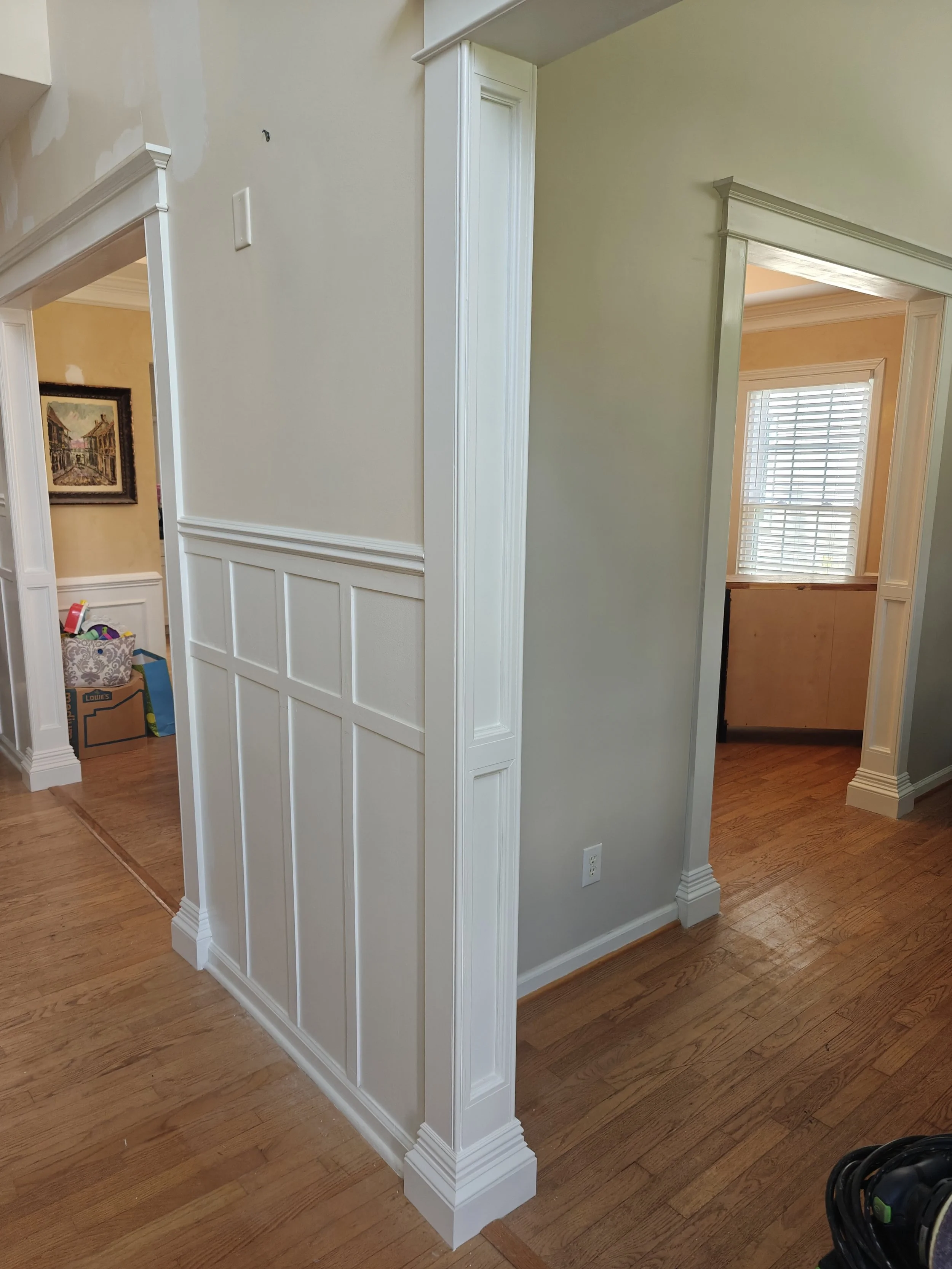 custom built craftsman style door casing and wainscoting