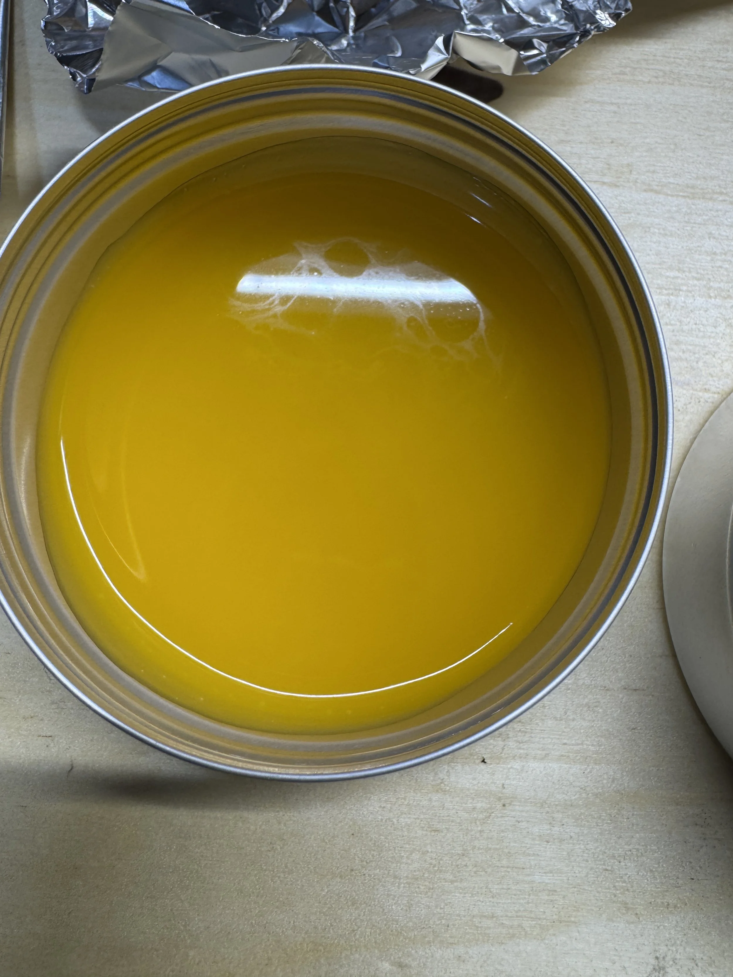 Poured hot into each tin and sealed.