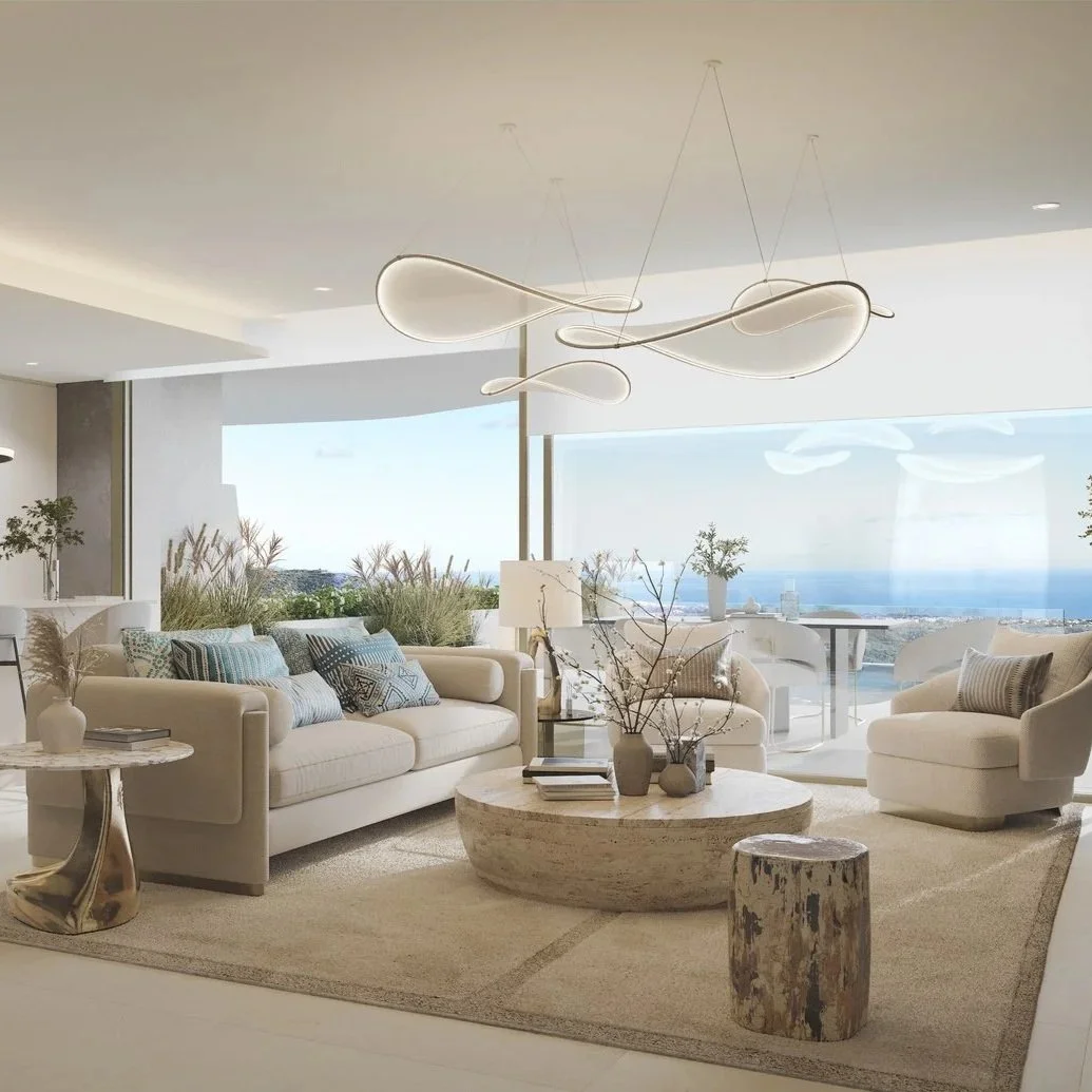 Contemporary living room in La Quinta apartment with cream sofas and ocean views