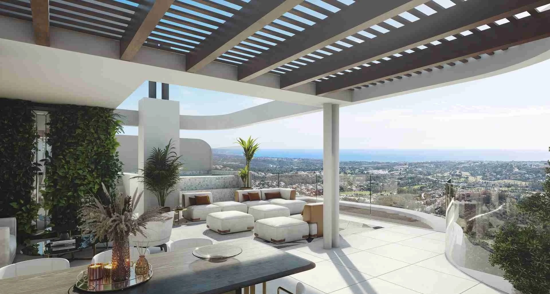 Rooftop terrace at Enebros Real de La Quinta with white seating, glass railing, shaded pergola, and ocean and city views