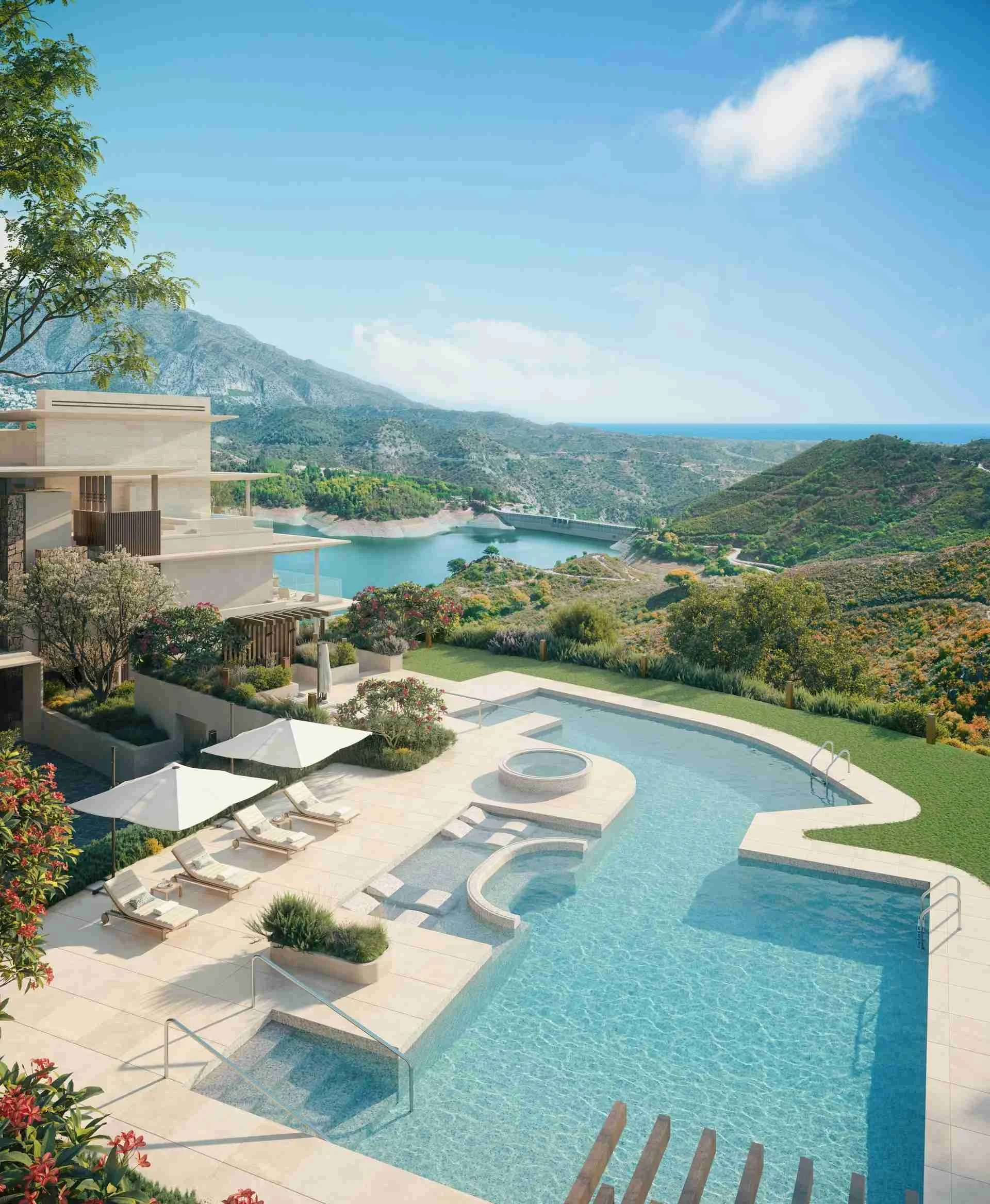 Swimming pool at Mimosas overlooking lake, green hills, and mountains in Real de La Quinta Benahavís