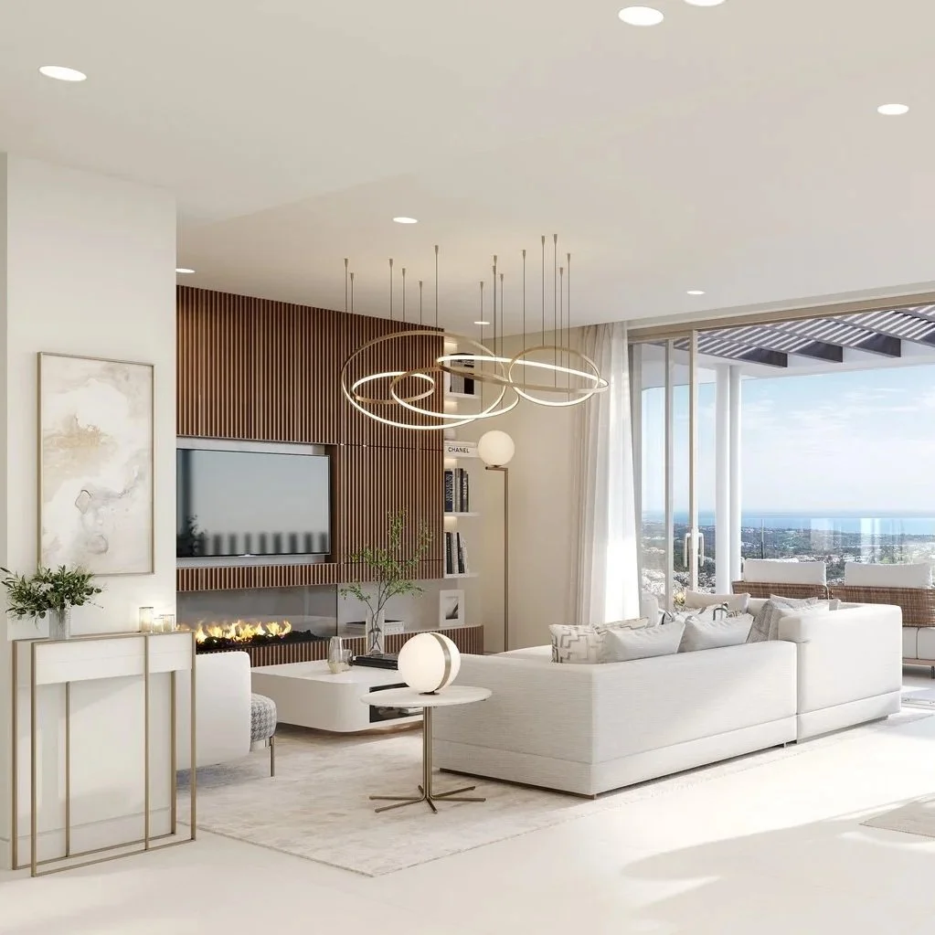 Living room with white sofa, contemporary chandelier, and panoramic city and ocean views in La Quinta