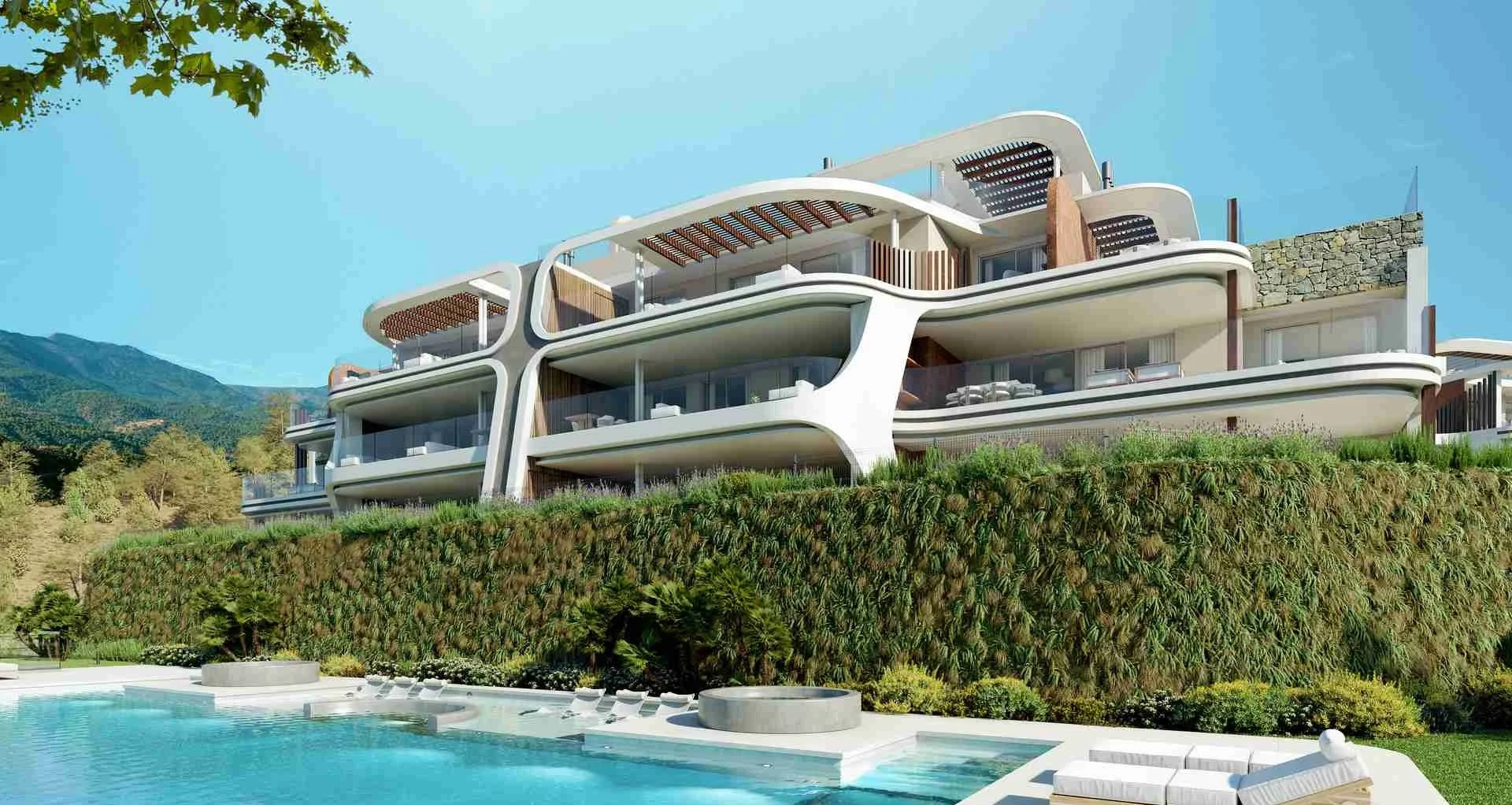 Enebros hillside residences at Real de La Quinta, Benahavís Marbella with curved balconies, swimming pool, and mountain views