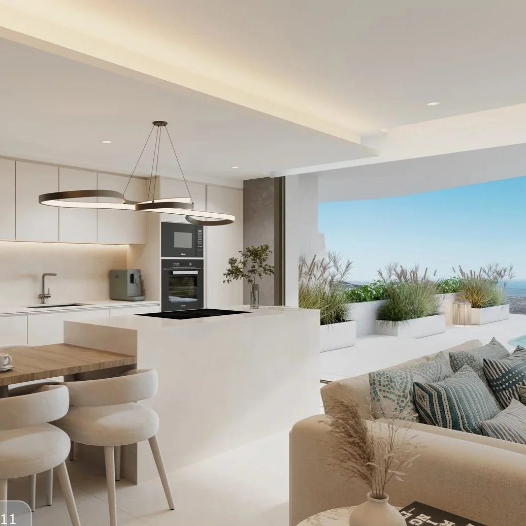 Open-concept kitchen and living area in Marbella apartment with white cabinets and balcony view