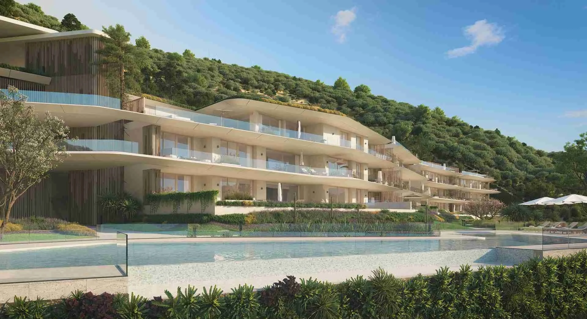 Romero apartments in Real de La Quinta, Benahavís Marbella, with glass balconies, hillside views, and swimming pool