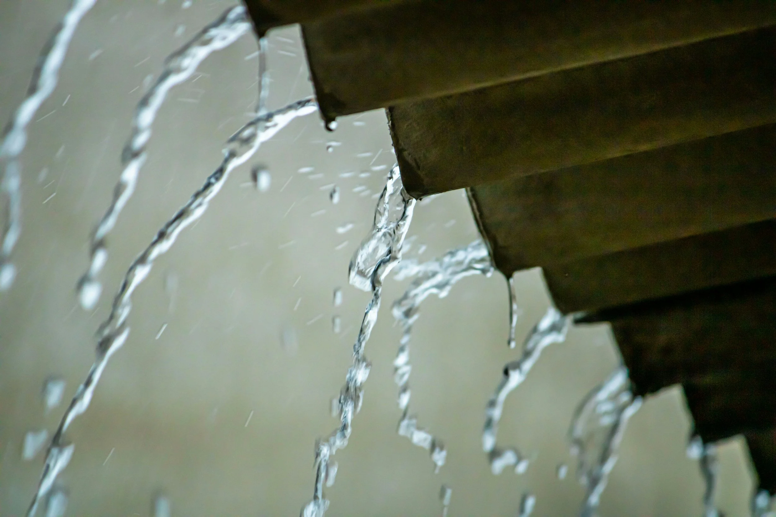 Rainwater falling off roof