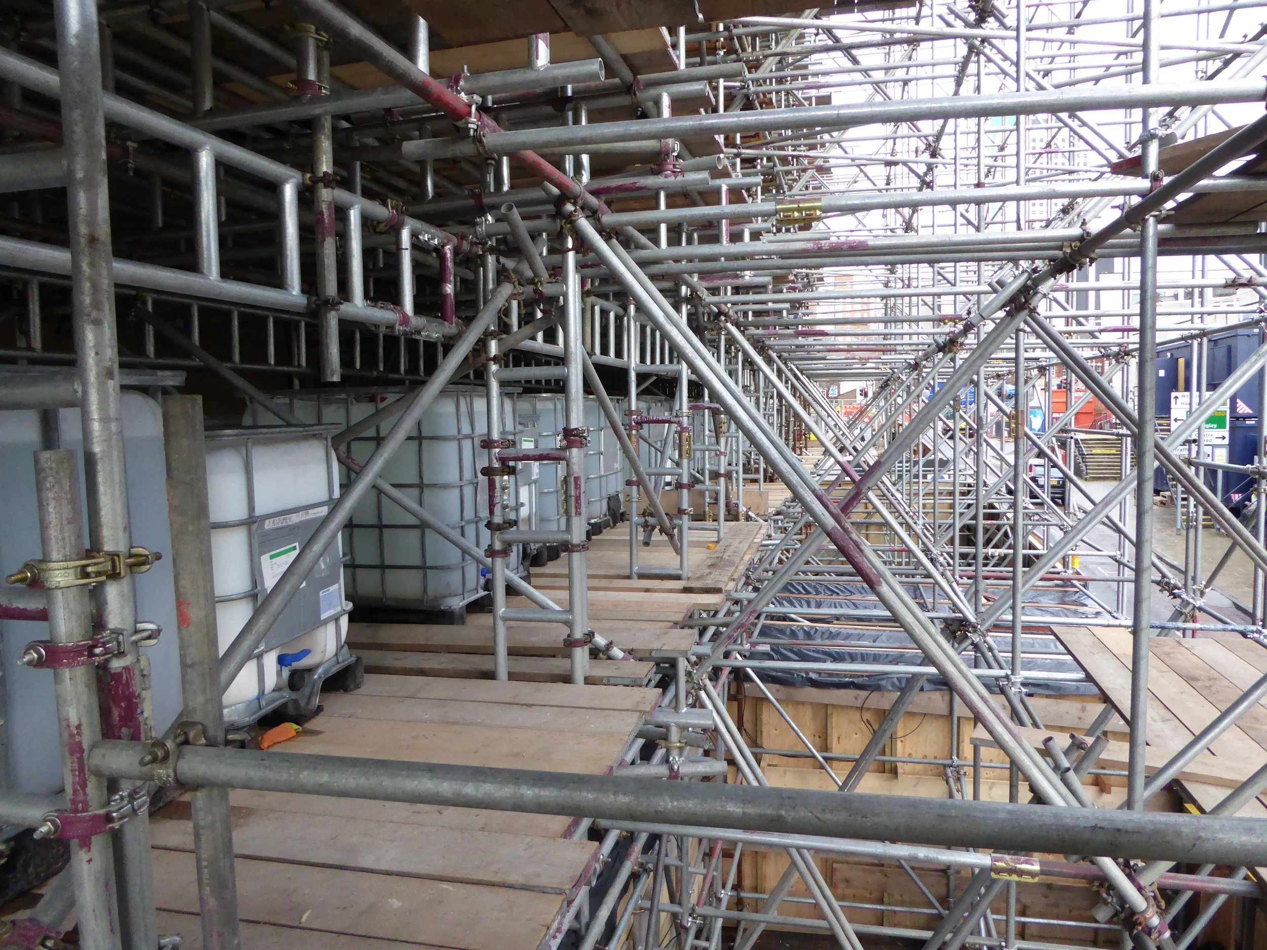 Facade shore made from scaffolding giving access to building