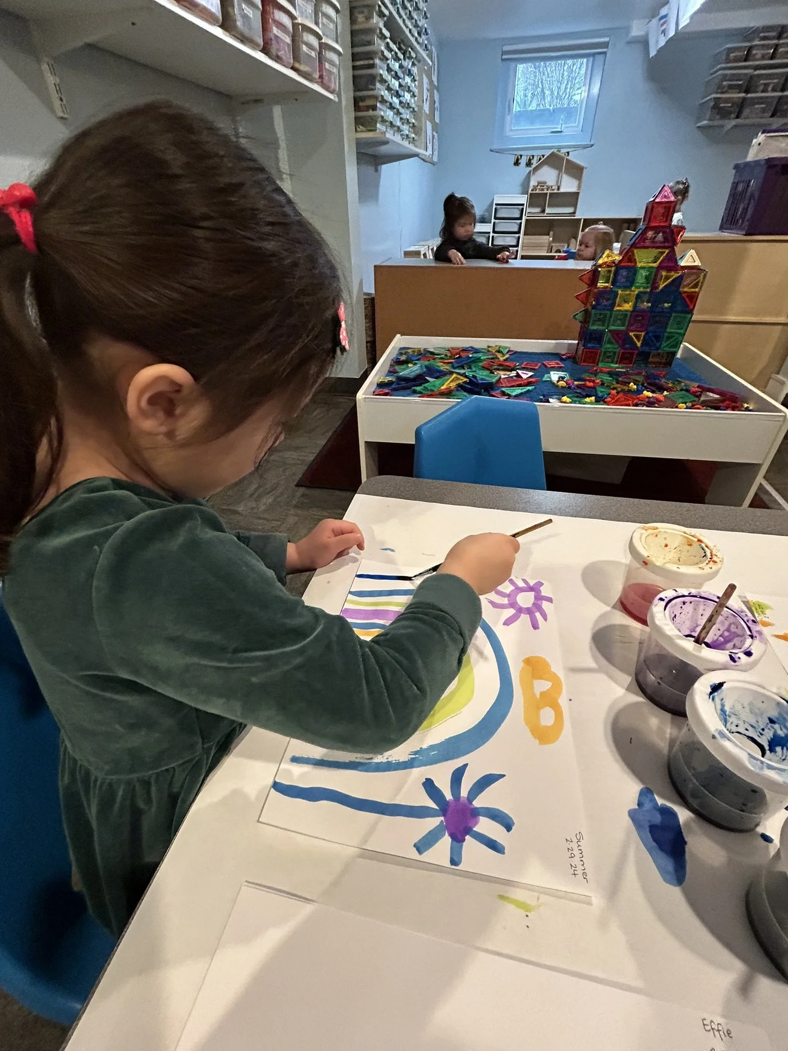 A child painting at Beaumont Children's Center bilingual Chinese preschool in Portland, Oregon