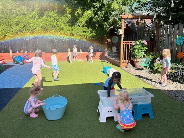 Children-led playtime with water outside at Beaumont Children's Center bilingual Chinese preschool in Portland, Oregon